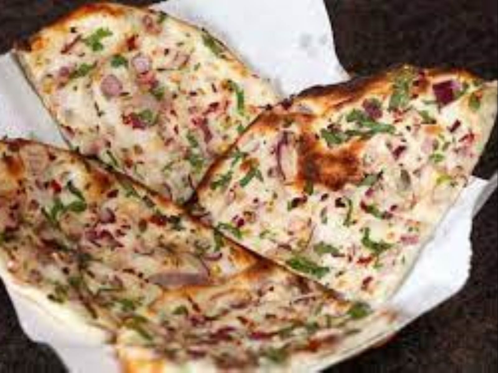 Order Onion Naan food online from Passage to India store, Cambridge on bringmethat.com