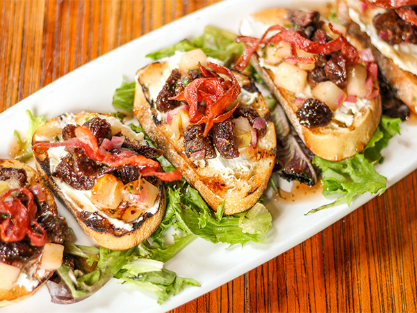 Order Fig and Goat Cheese Bruschetta  food online from Gravity Taphouse Grille store, Grand Rapids on bringmethat.com