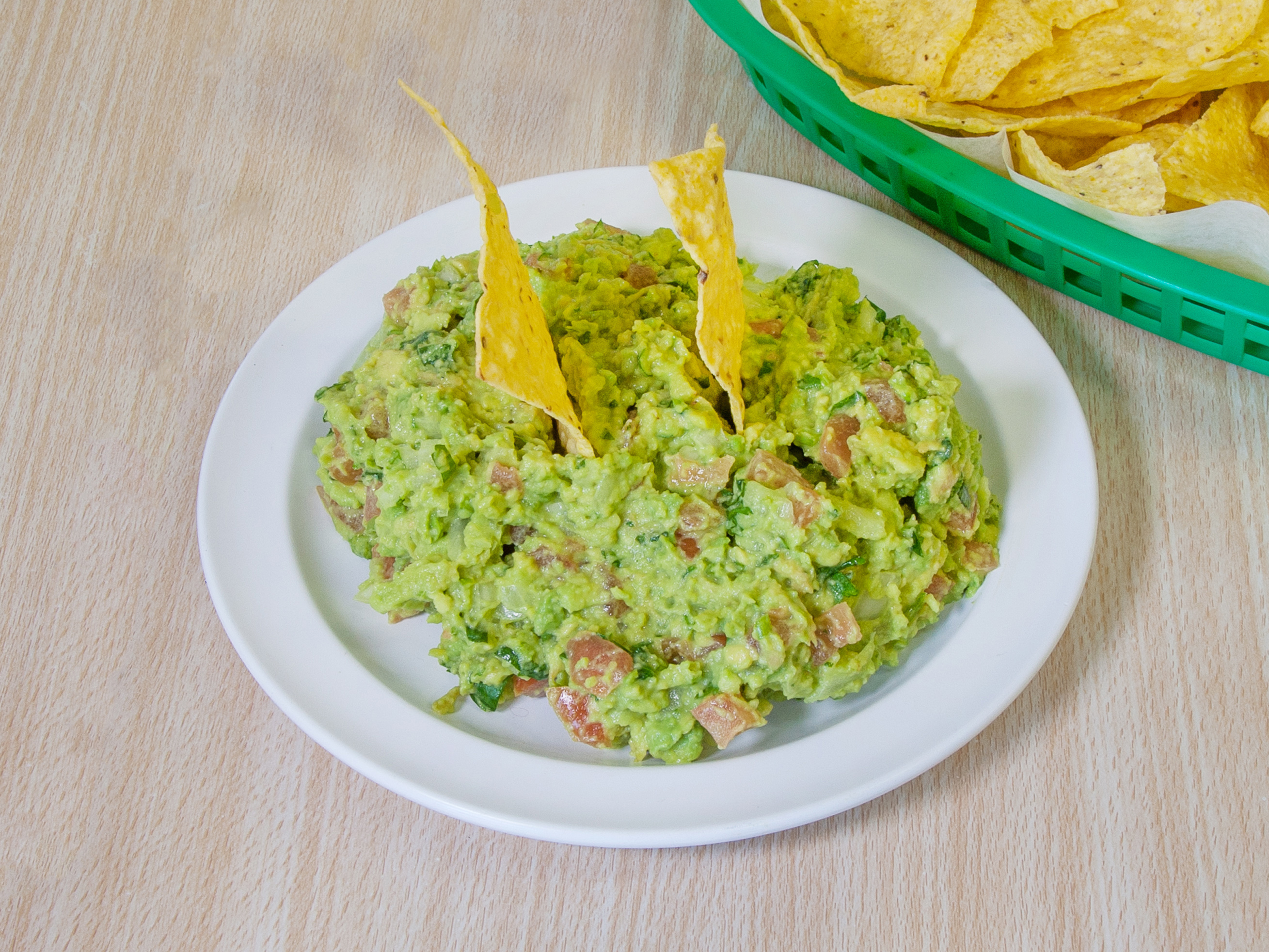 Order Guacamole with Chips food online from Baby Burritos store, Chicago on bringmethat.com