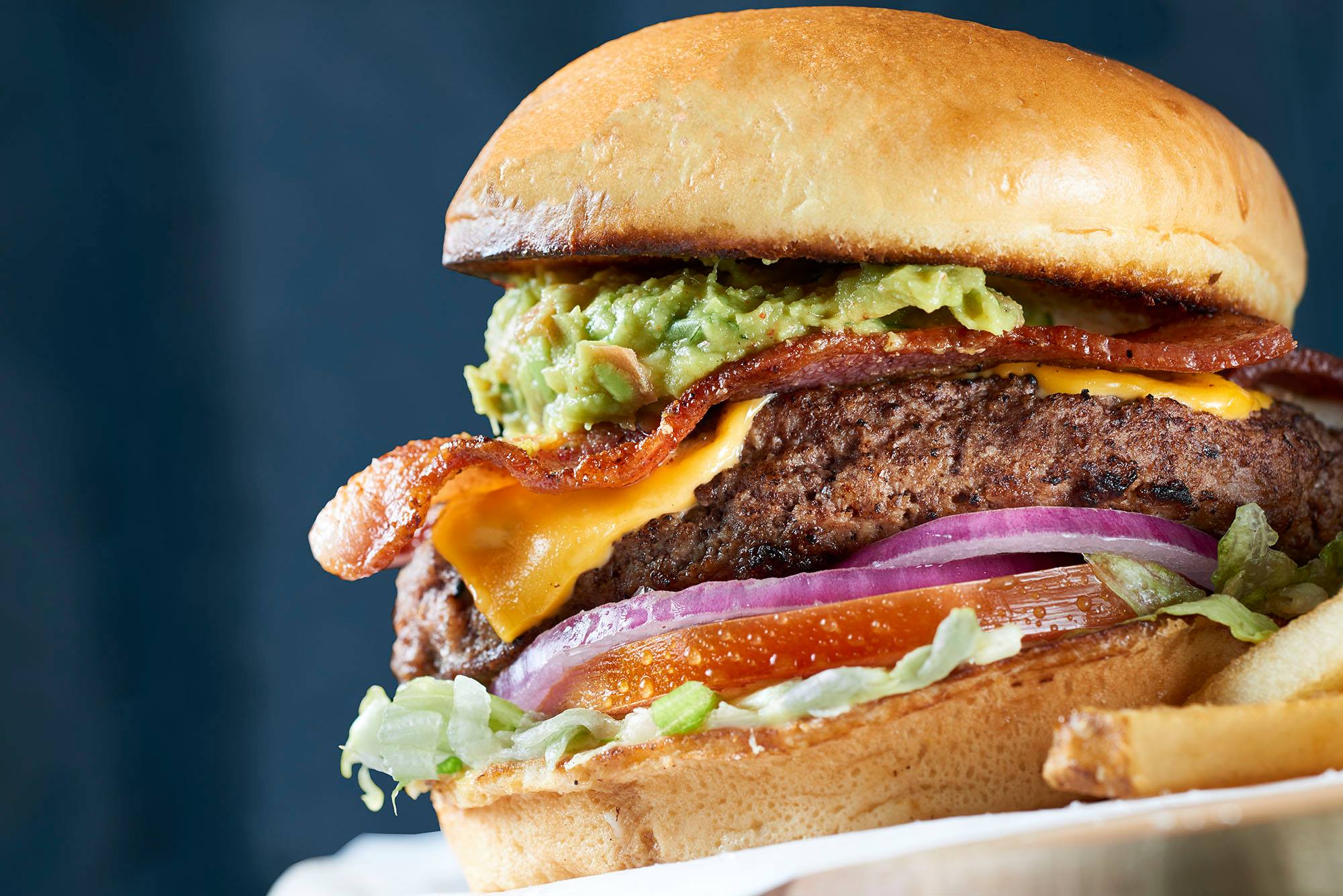 Order Bacon Guacamole Burger food online from Hurricane Grill & Wings store, Poughkeepsie on bringmethat.com