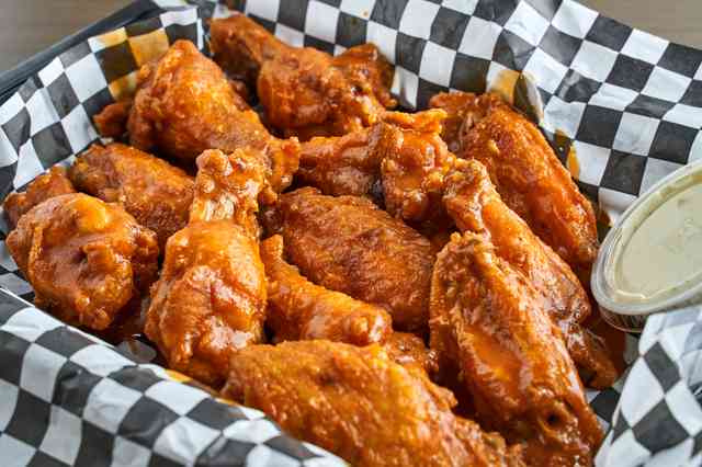 Order 20 wings food online from Vino's Pizzeria store, Greensboro on bringmethat.com