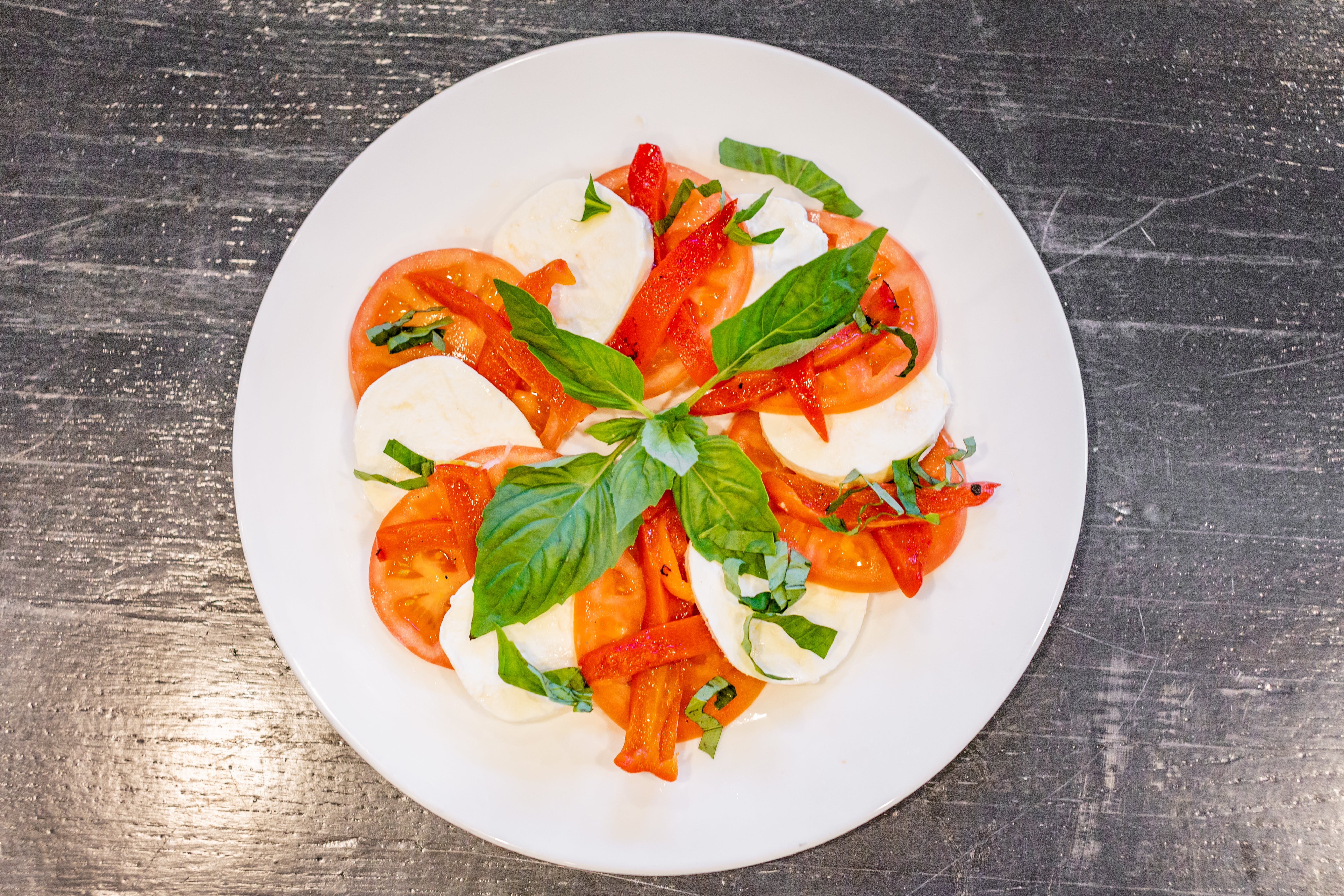 Order Caprese Salad - Large food online from Joey's Pizza store, Milford on bringmethat.com