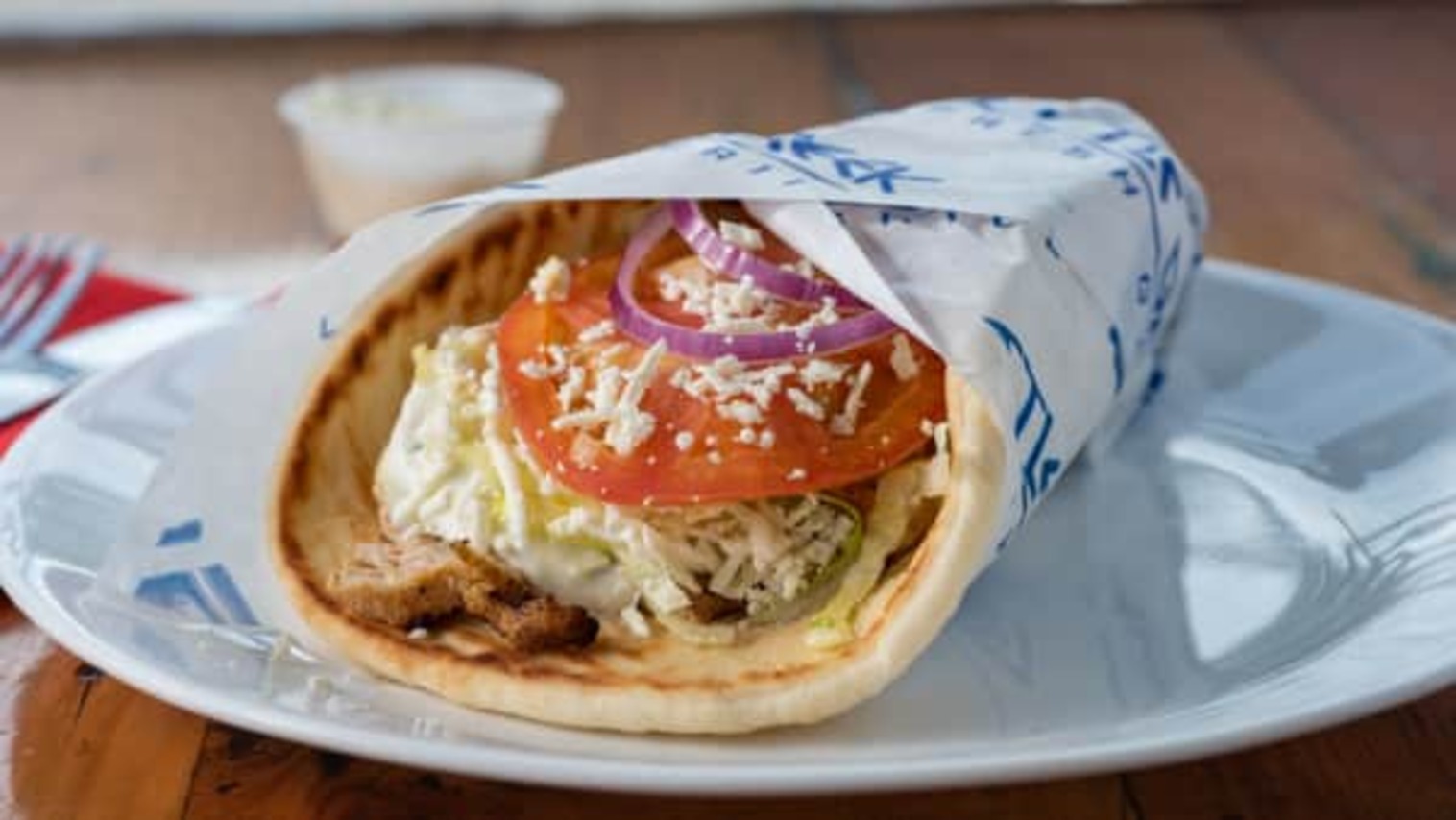 Order GREEK CHICKEN PITA food online from Little Greek Fresh Grill store, Youngstown on bringmethat.com