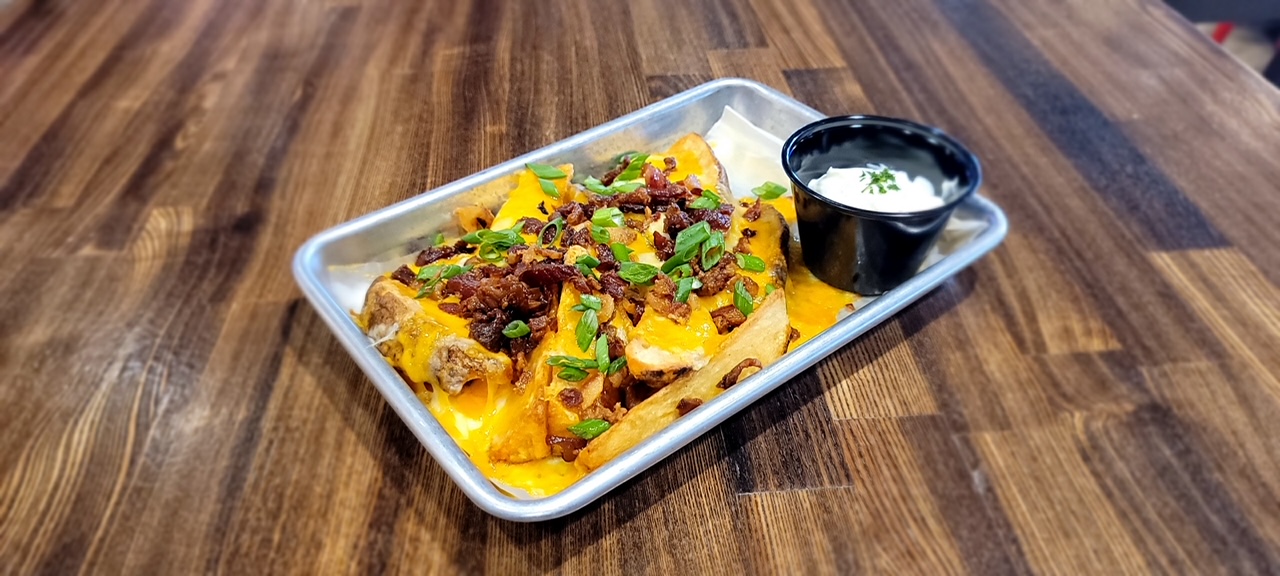 Order Loaded Potato Wedges food online from Ten Pin Alley store, Hilliard on bringmethat.com