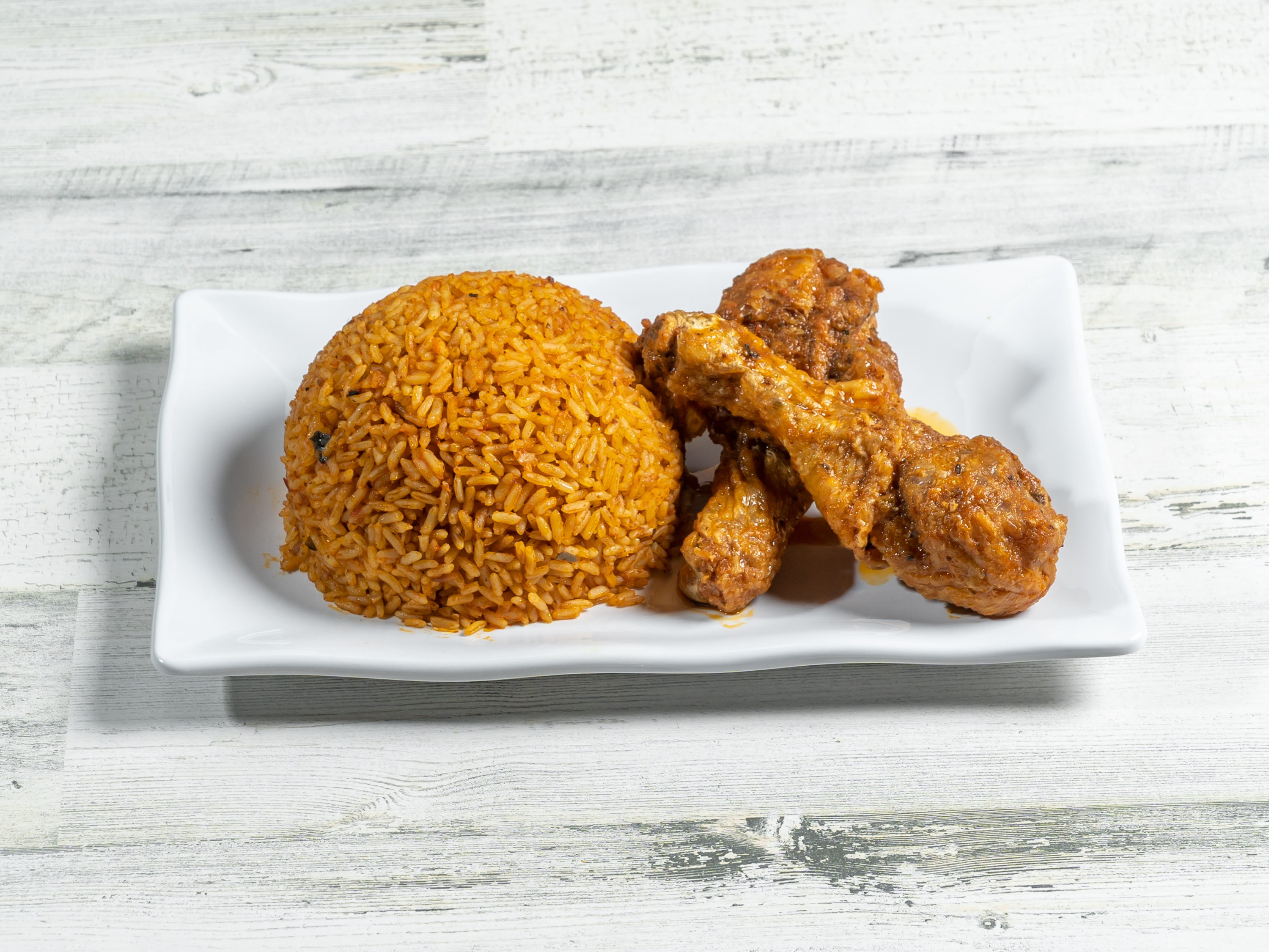 Order Jollof Rice and Chicken food online from Aso Rock African Restaurant store, Dallas on bringmethat.com