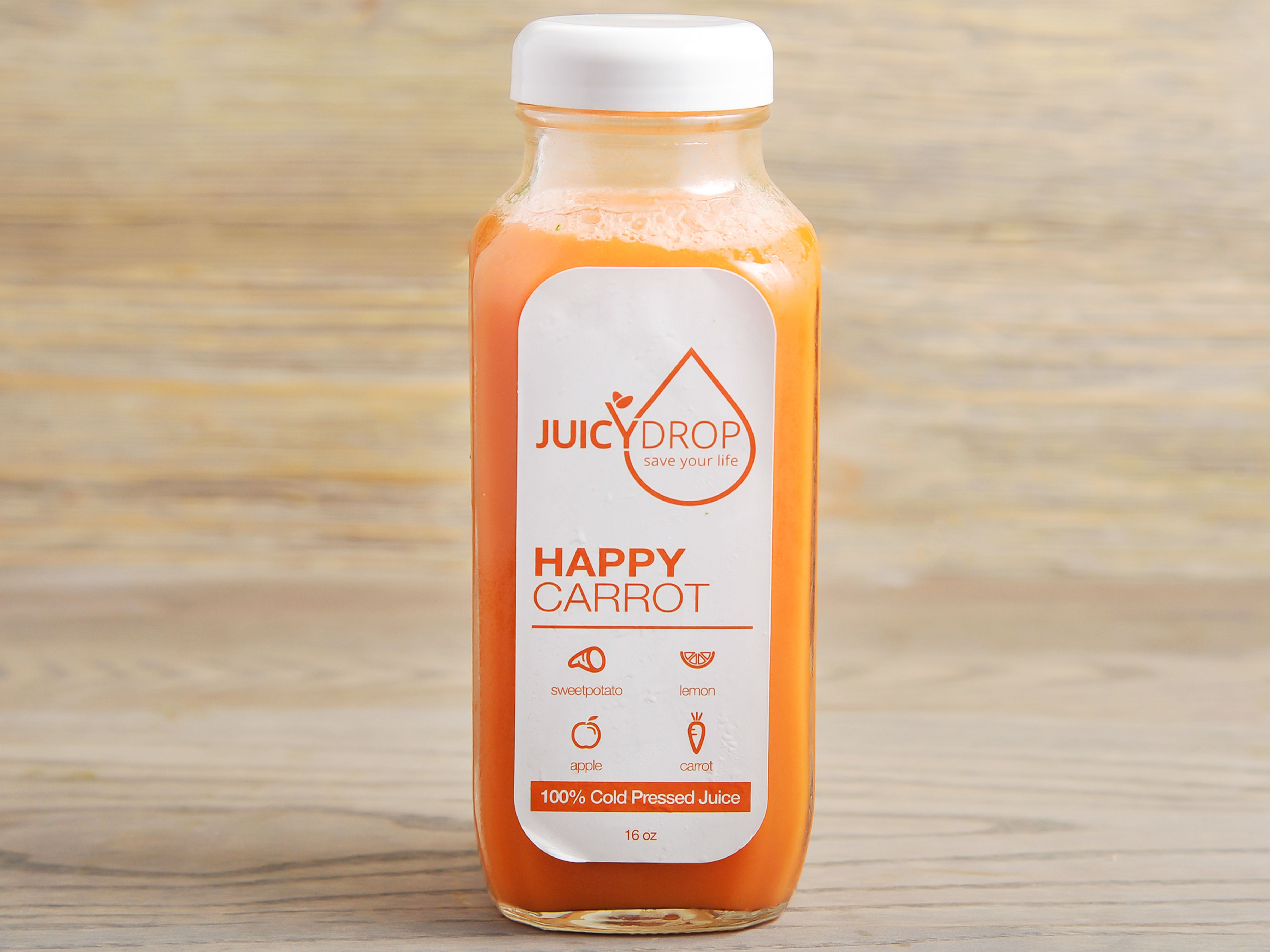 Order 16 oz. Happy Carrot Juice food online from Juicy Drop store, Decatur on bringmethat.com