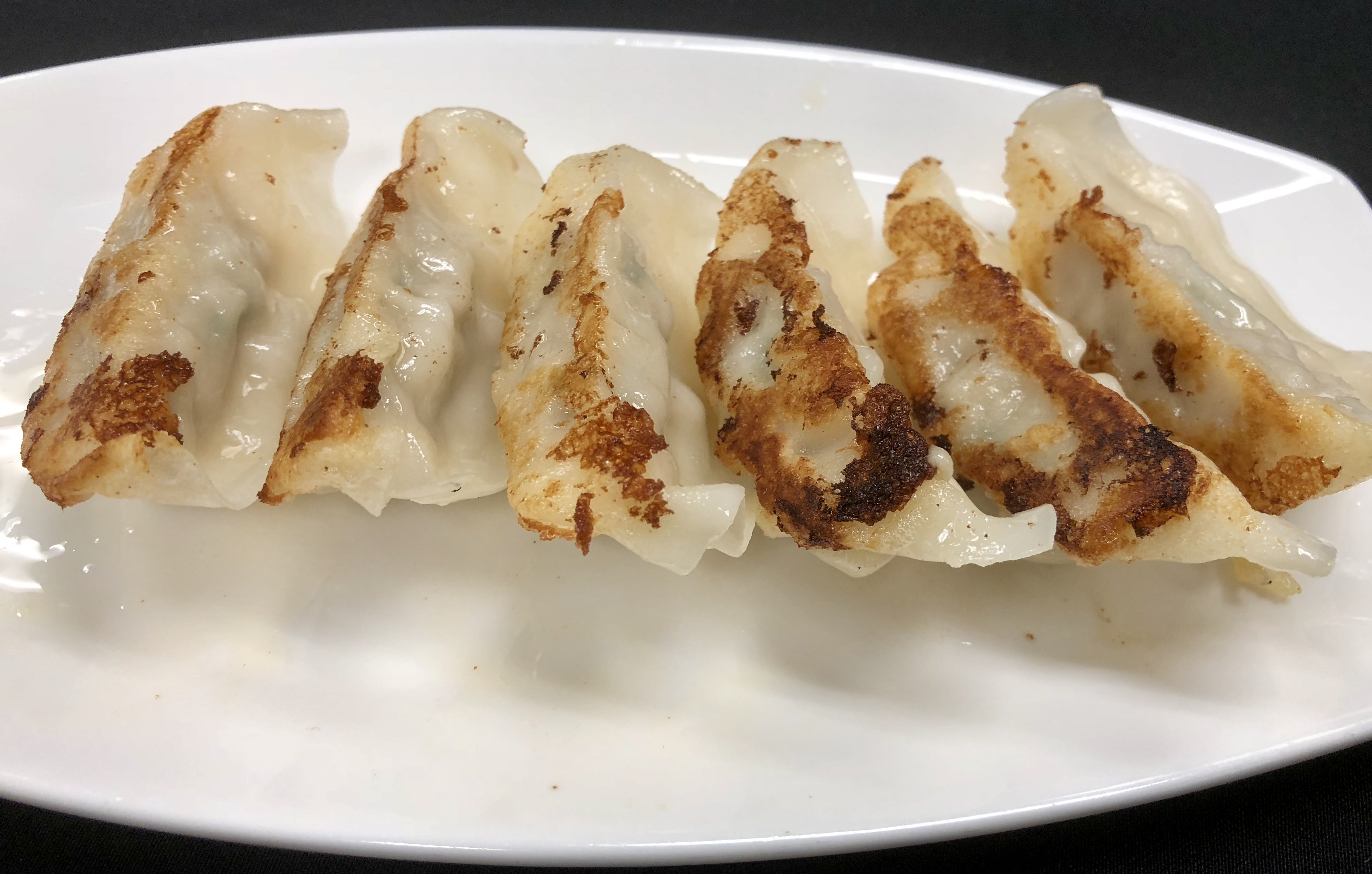 Order 6 Pieces Gyoza food online from Feng Shui Kitchen store, Waltham on bringmethat.com