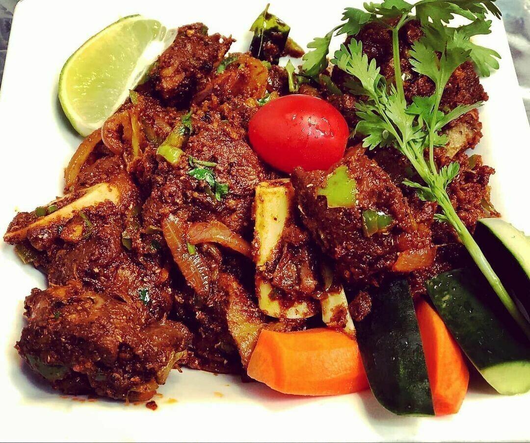 Order Goat Sukka food online from Peacock Indian Cuisine store, Plano on bringmethat.com