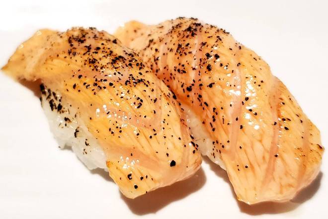 Order Pepper Salmon Nigiri food online from Sake 2 Me Sushi store, Tustin on bringmethat.com