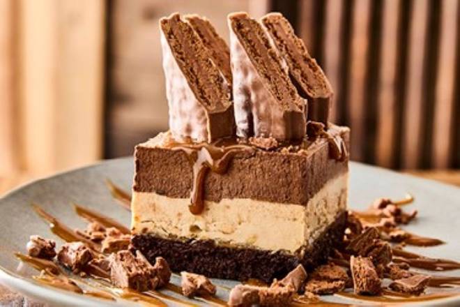 Order NEW! Tim Tam® Brownie Cake food online from Outback Steakhouse store, Charlotte on bringmethat.com