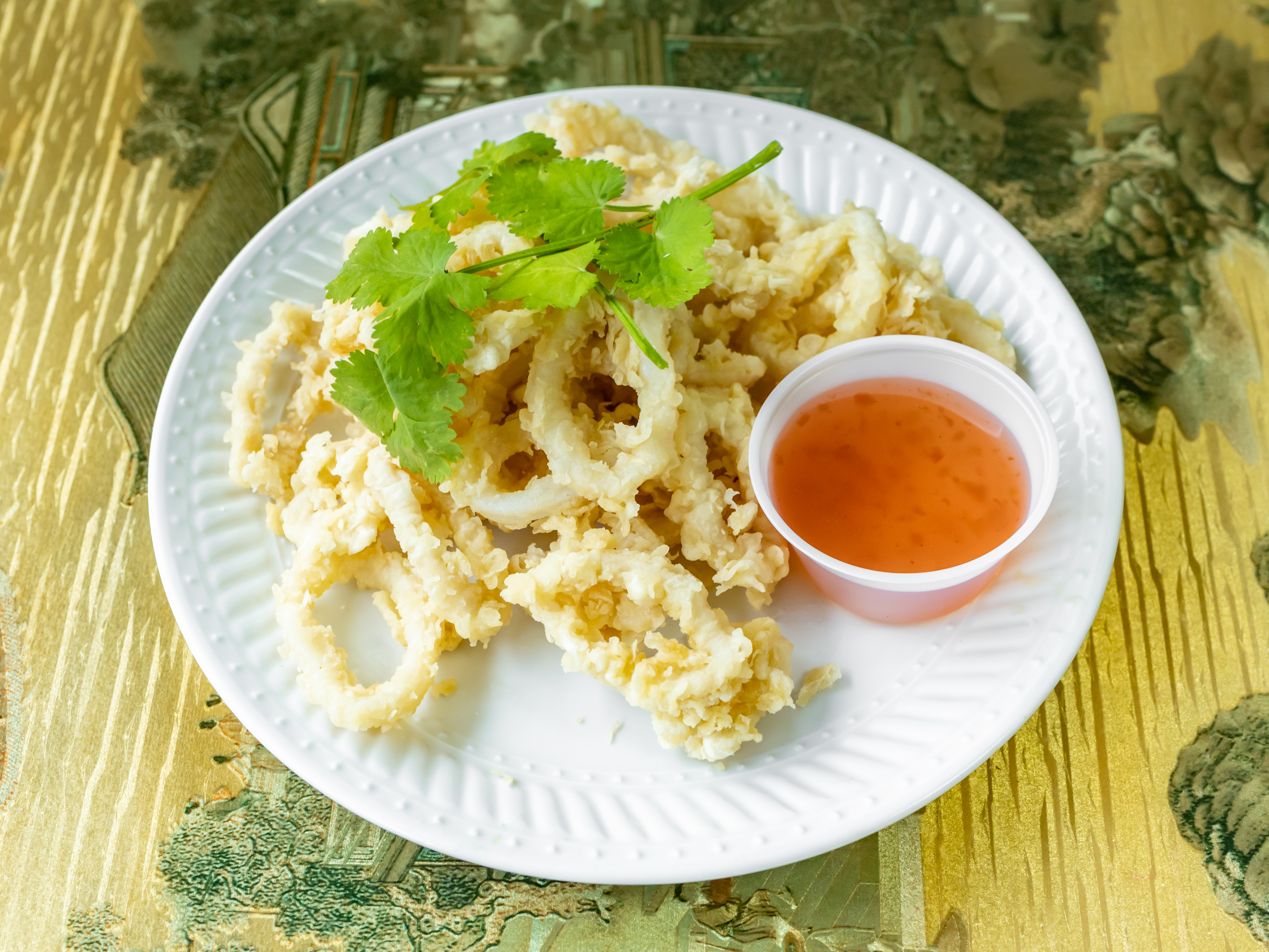 Order 21. Fried Calamari food online from New Rooster Kitchen store, Mastic Beach on bringmethat.com