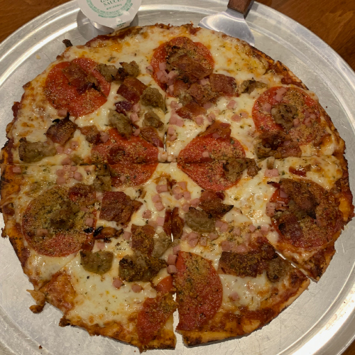 Order 12'' Meat Lovers Pizza food online from The Woodford Club store, Versailles on bringmethat.com