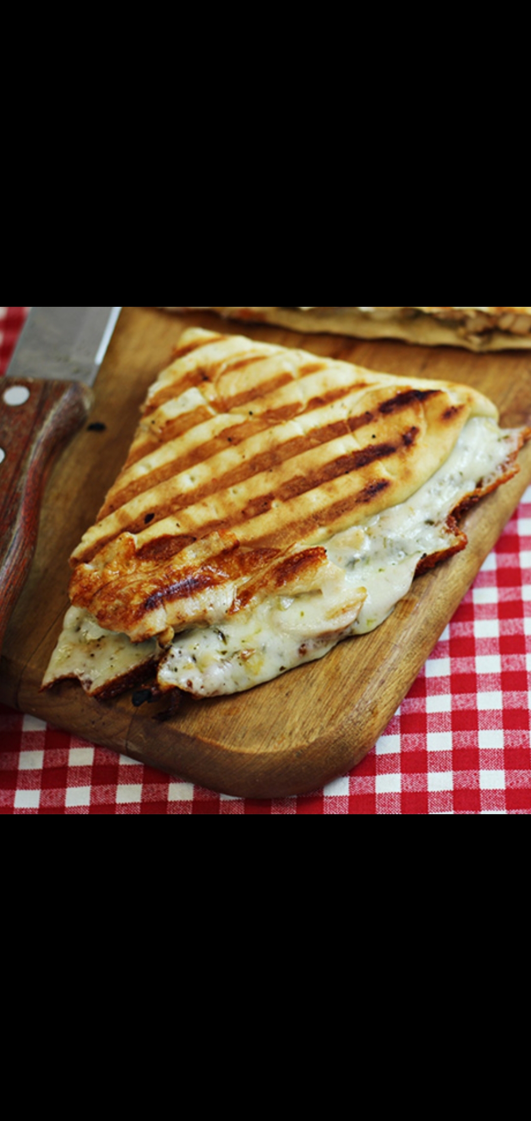 Order  Grilled Chicken Pesto Panini (grilled chicken pesto sauce cheese peppers onions parmesan cheese & tomatoes) food online from American Gourmet Foods Deli store, New York on bringmethat.com