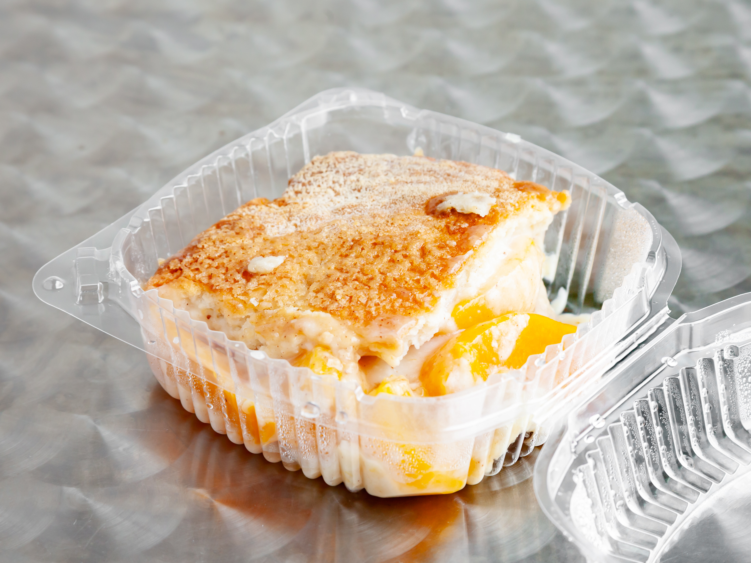Order Grandma's Peach Cobbler food online from Kansas City Barbecue Pit store, Decatur on bringmethat.com