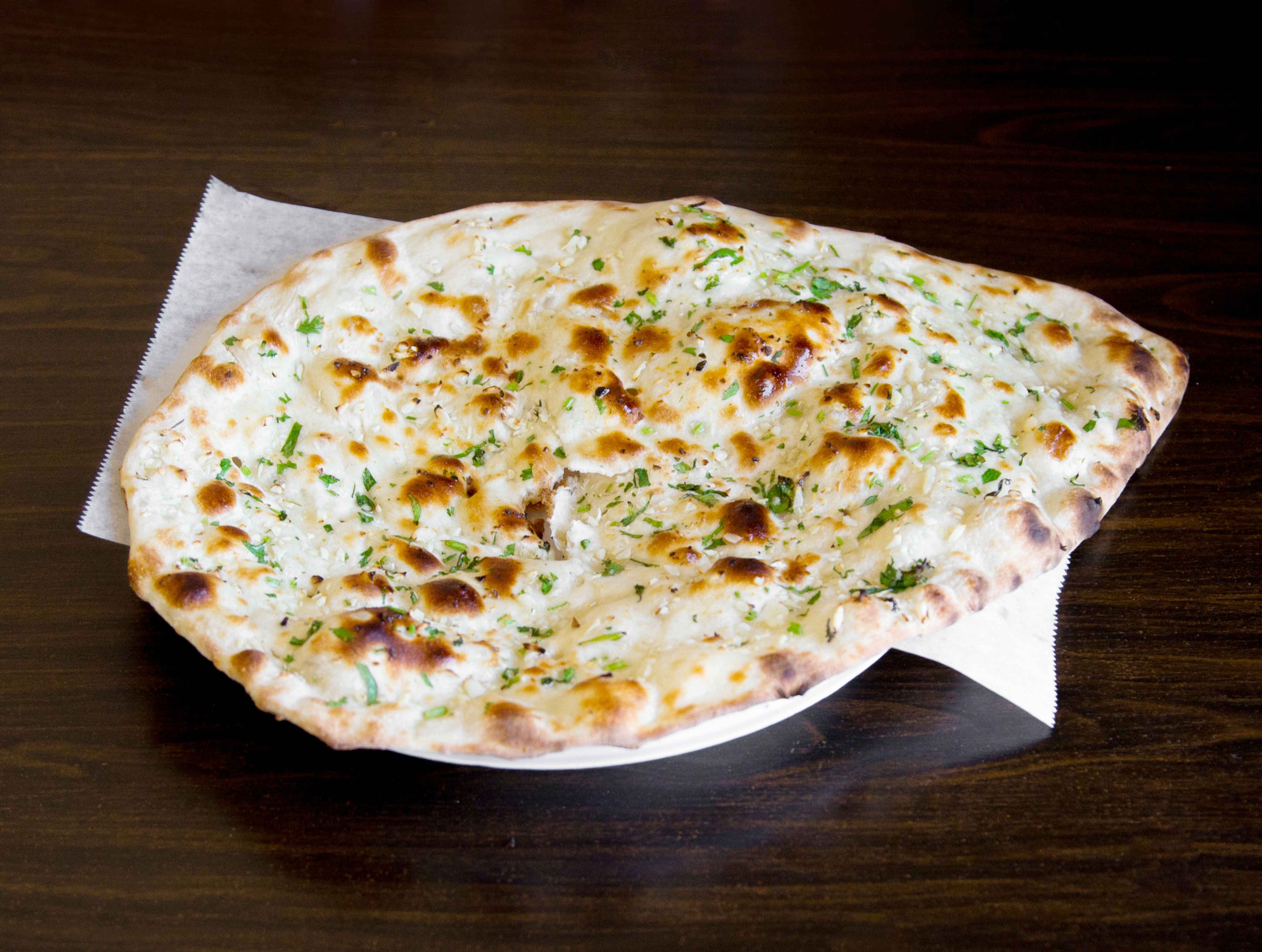 Order Garlic Naan food online from House of Curry store, Los Angeles on bringmethat.com