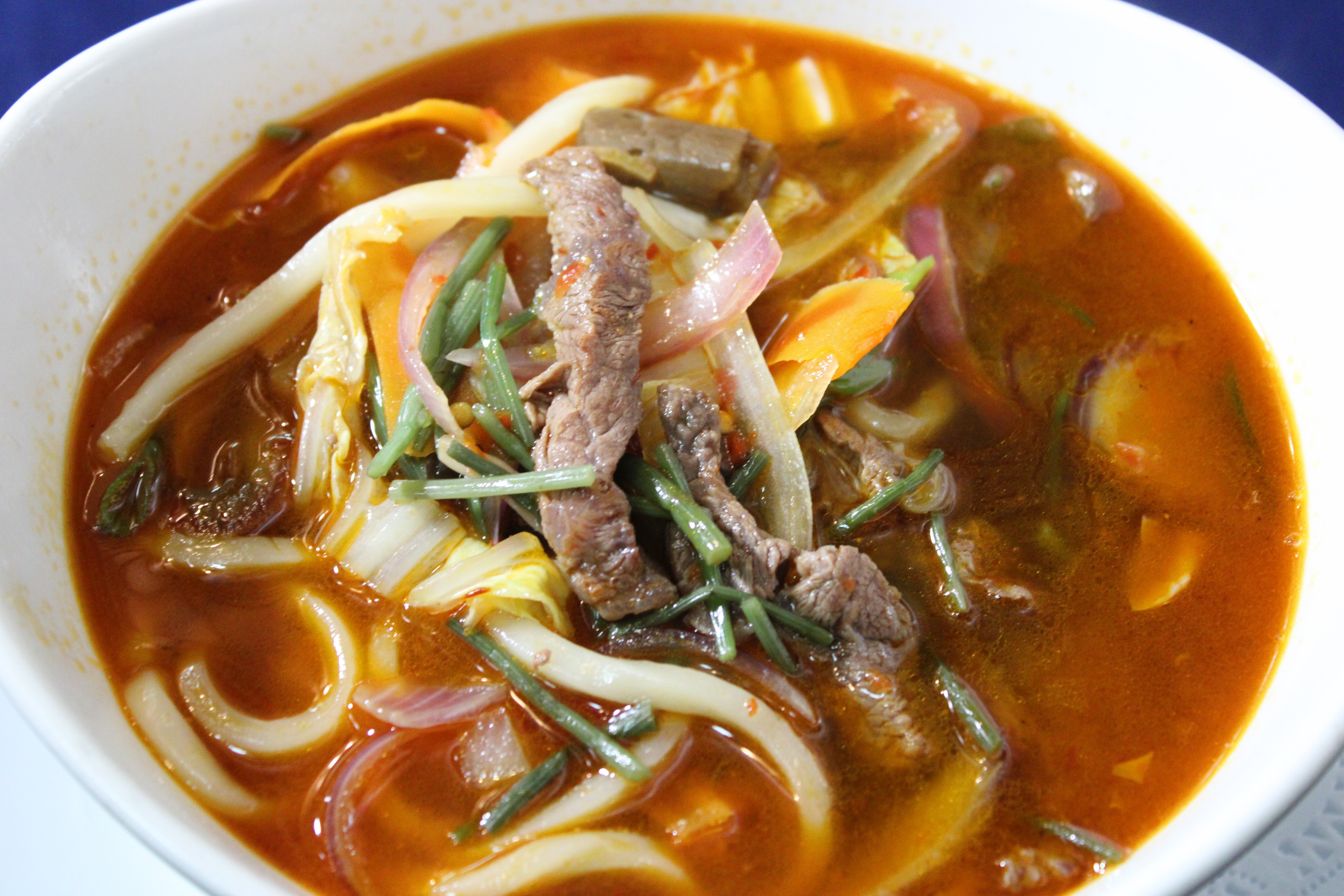 Order Spicy Beef Udon food online from Kibo Sushi store, Ventura on bringmethat.com