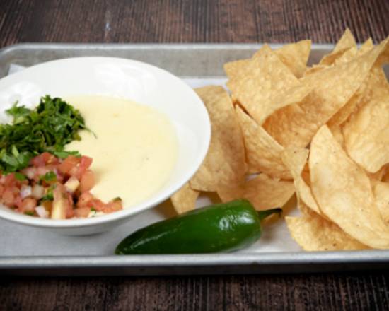 Order BWhizzy's Chips & Queso food online from BWhizzy's store, Conroe on bringmethat.com