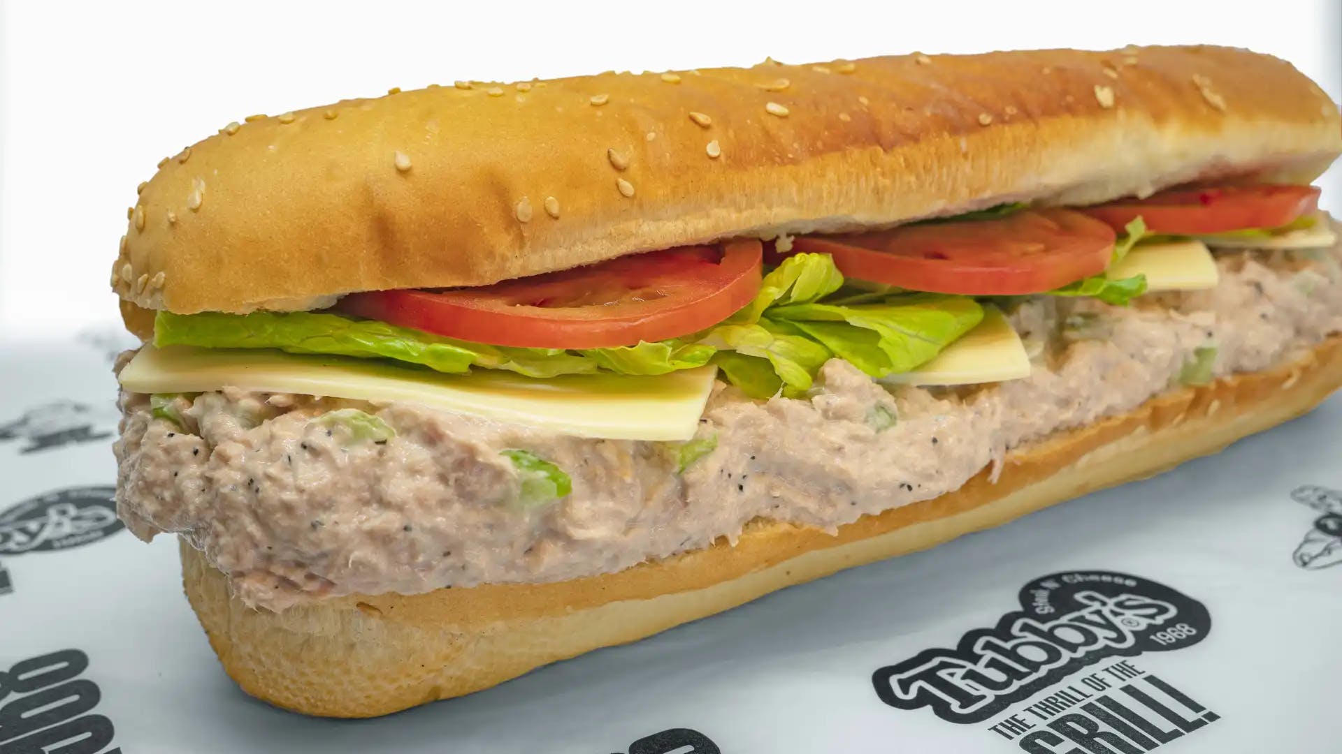 Order Tuna Sub - Small food online from Tubby's Grilled Submarines store, Westland on bringmethat.com