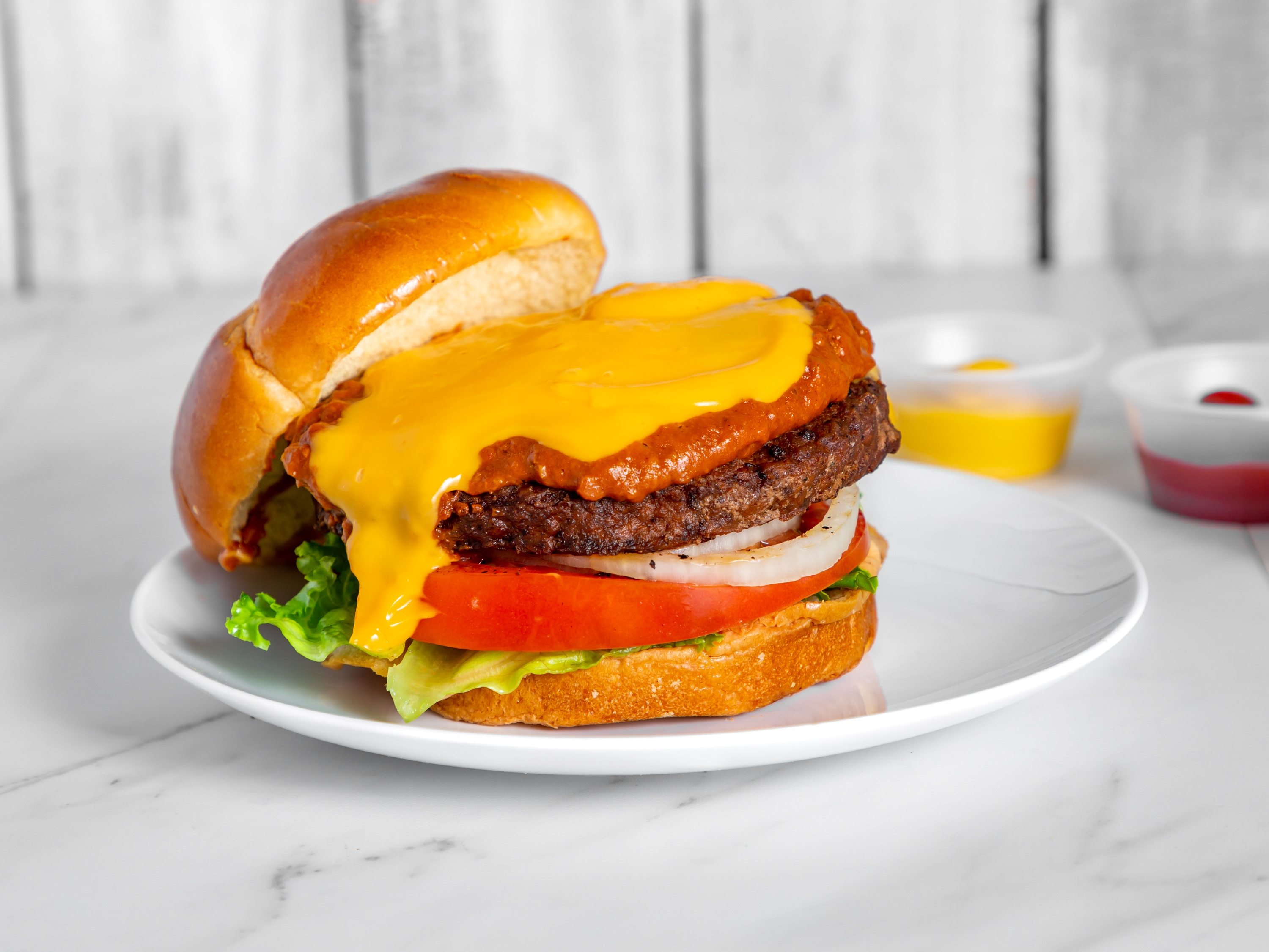 Order 1/2 lb Show Me Burger (Chili and Nacho Cheese) food online from Burger Guys store, Kansas City on bringmethat.com
