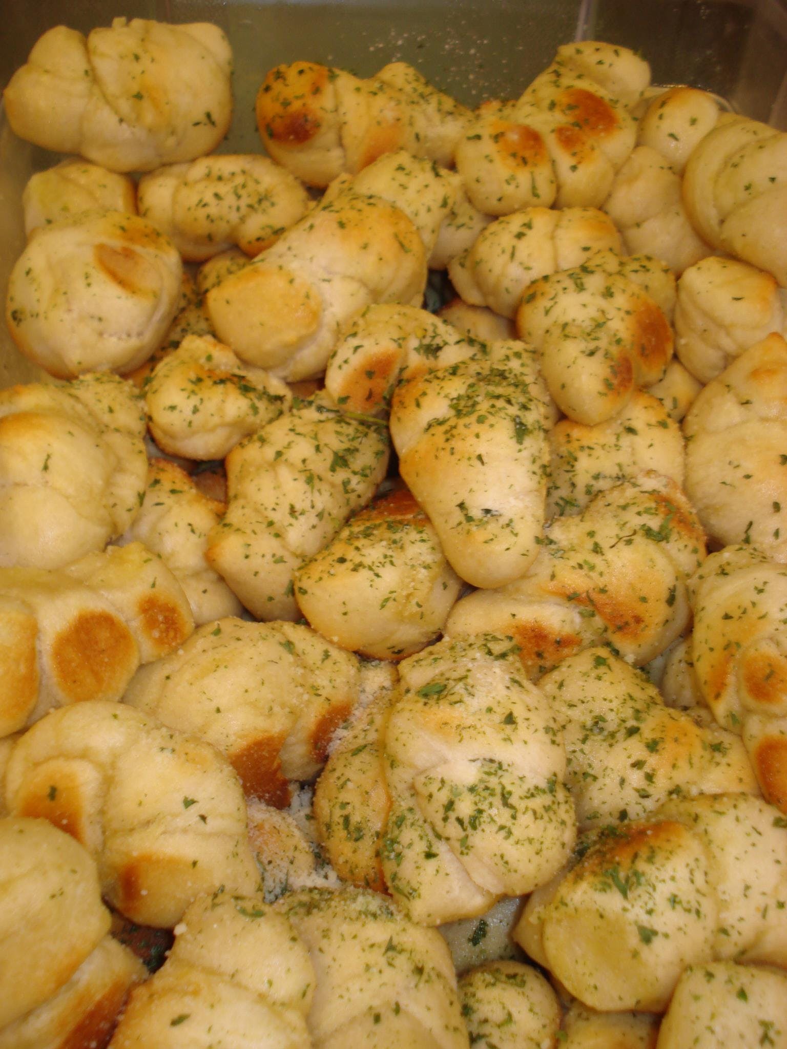 Order Garlic Knots - 8 Pieces food online from Milano's Pizza store, Collierville on bringmethat.com
