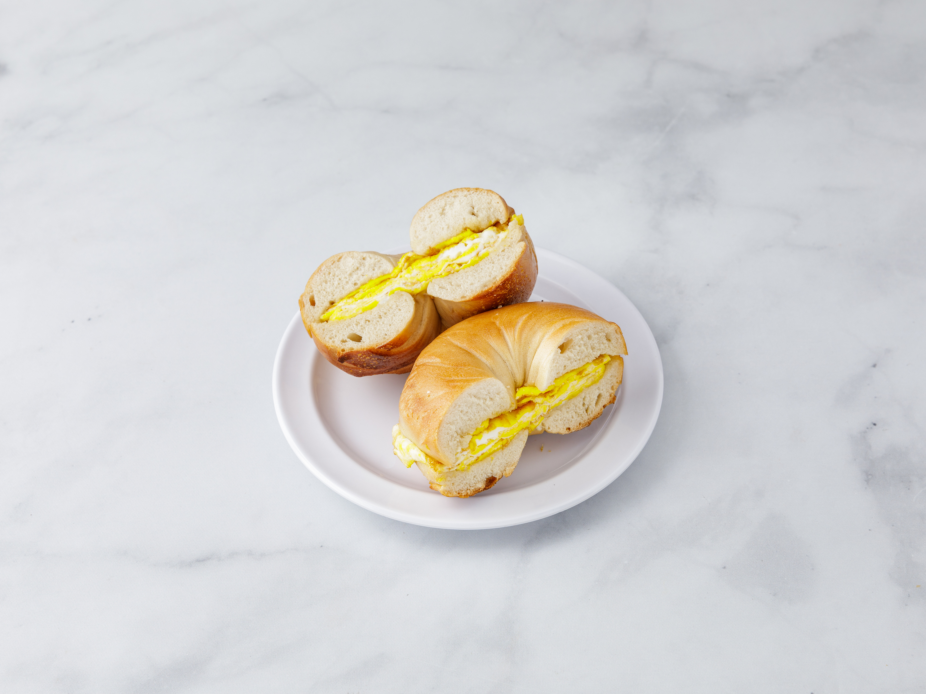Order 2 Eggs on a Bagel food online from Bread Brothers Bagel Cafe store, Brooklyn on bringmethat.com