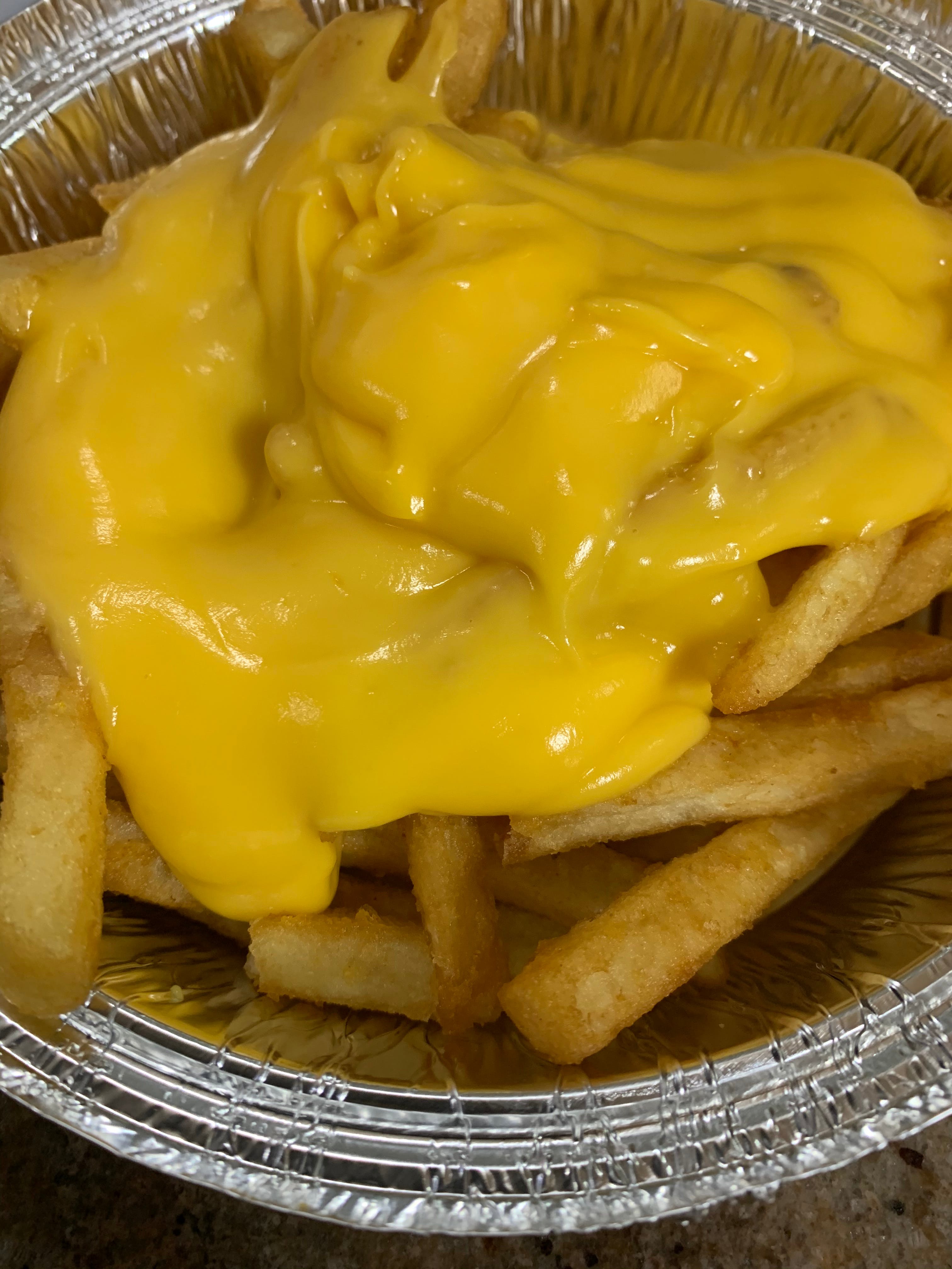 Order French Fries with Yellow Cheese - Side food online from Giovannelie Restaurant store, New Brunswick on bringmethat.com