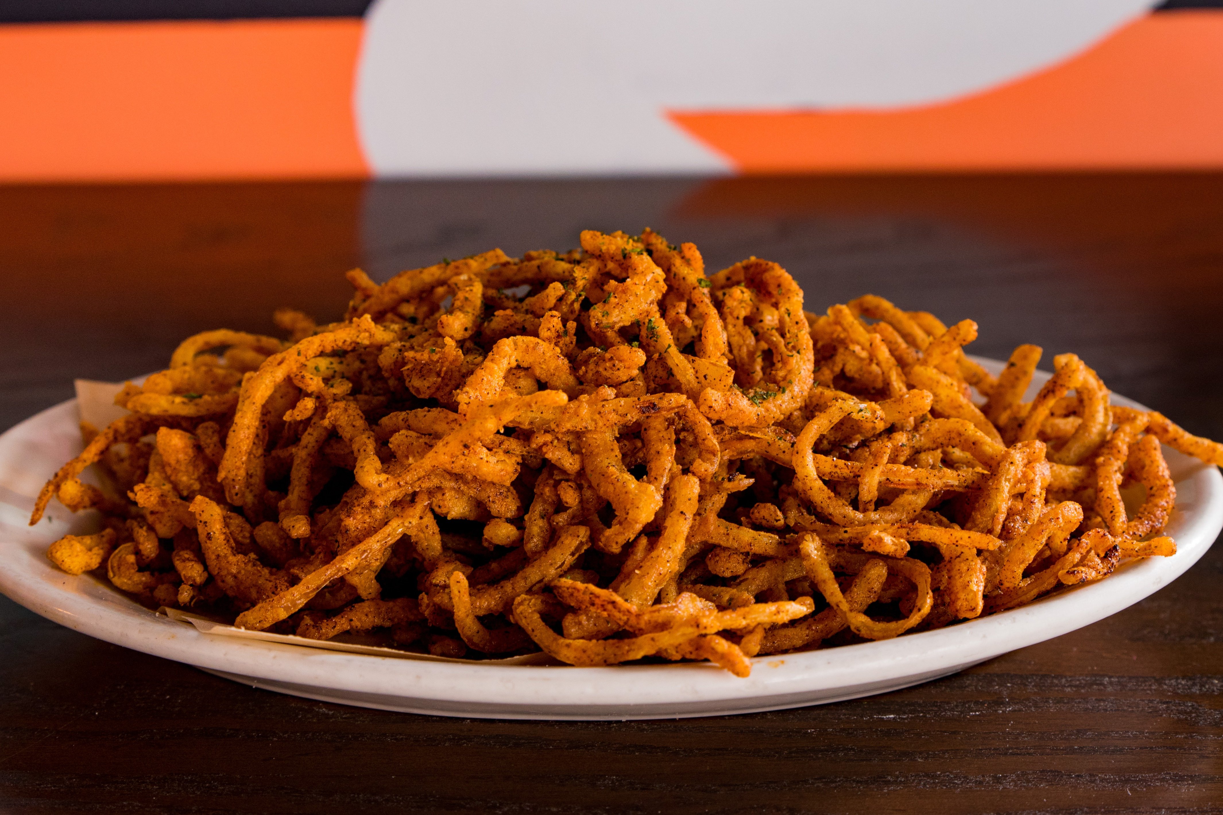 Order Chili-Rubbed Onion Strings food online from DMK Burger Bar store, Chicago on bringmethat.com