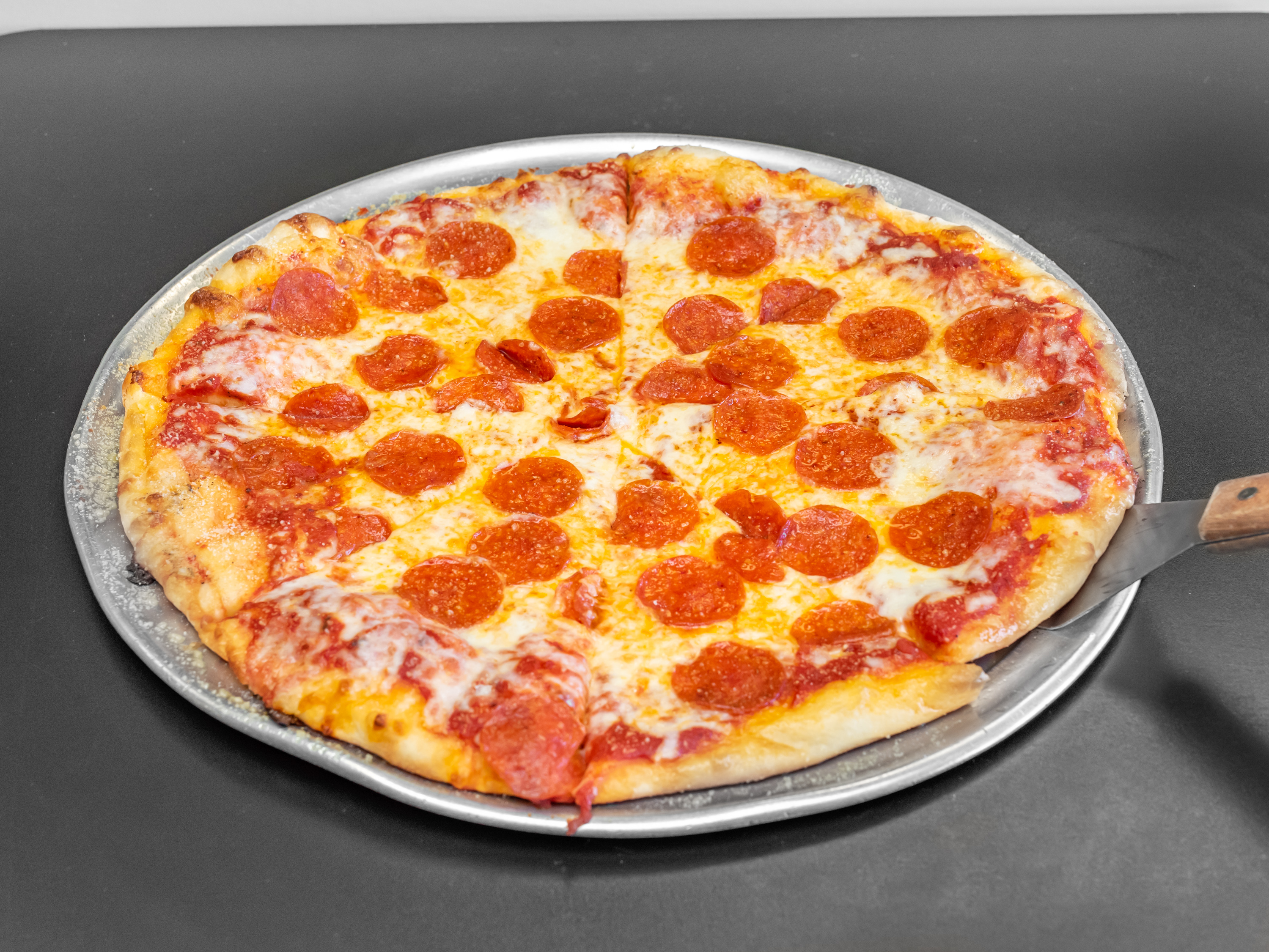 Order Pepperoni Pizza food online from Tonti's Pizzeria store, Parker on bringmethat.com