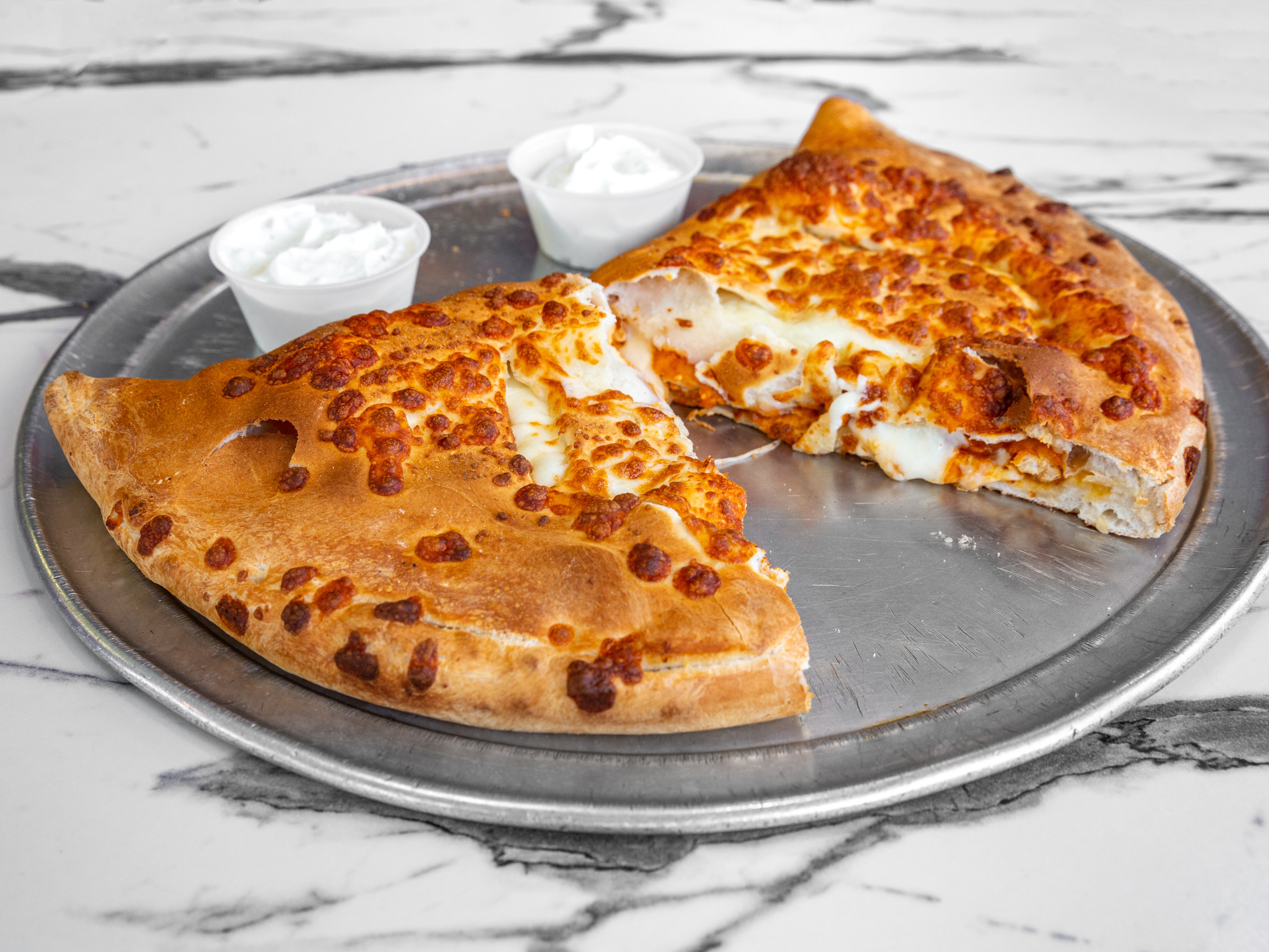 Order Buffalo chicken Calzone  food online from Olympic Pizza store, Arlington on bringmethat.com