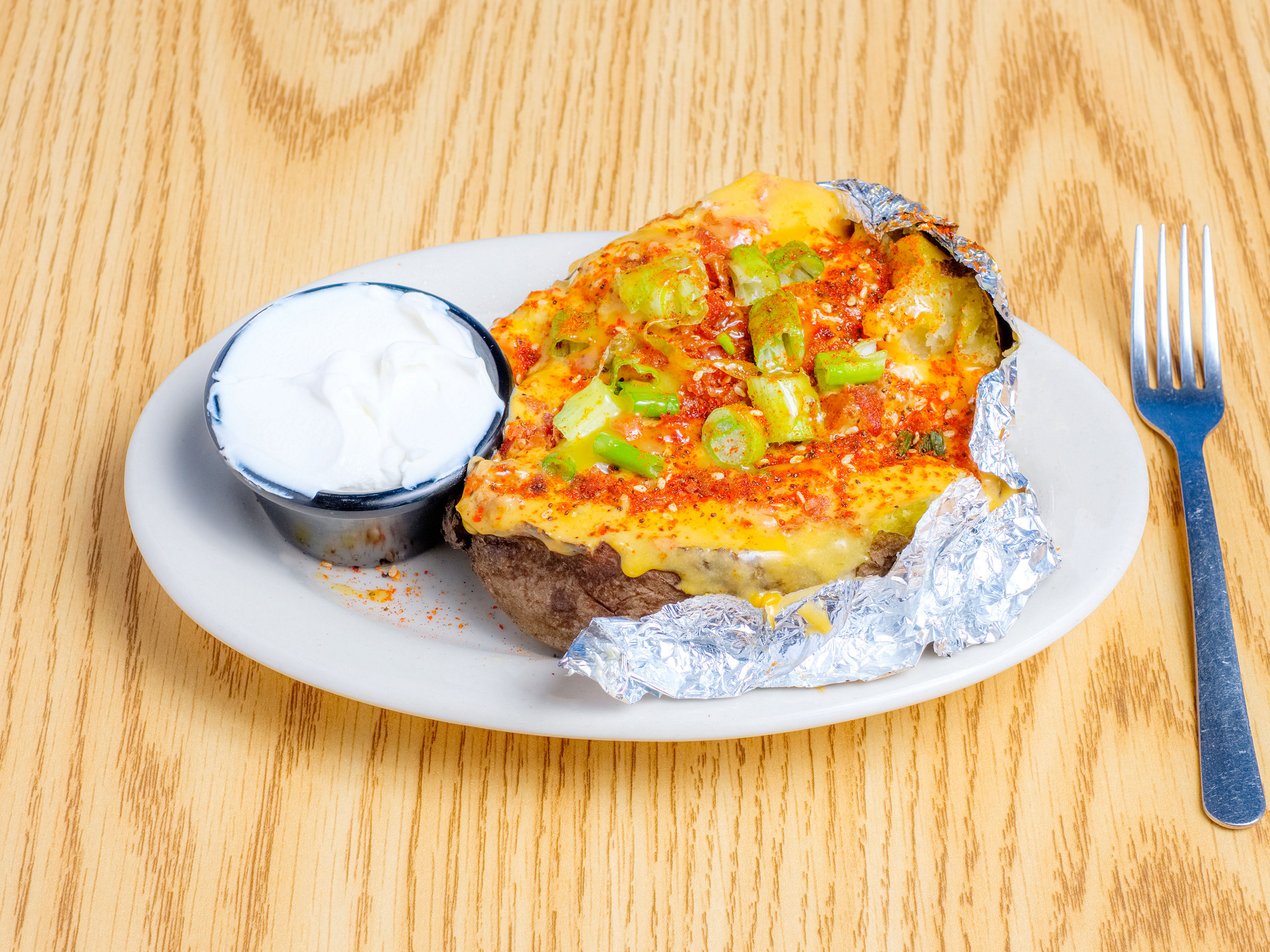 Order Loaded Baked Potato food online from Huge Impact Restaurant store, Indianapolis on bringmethat.com