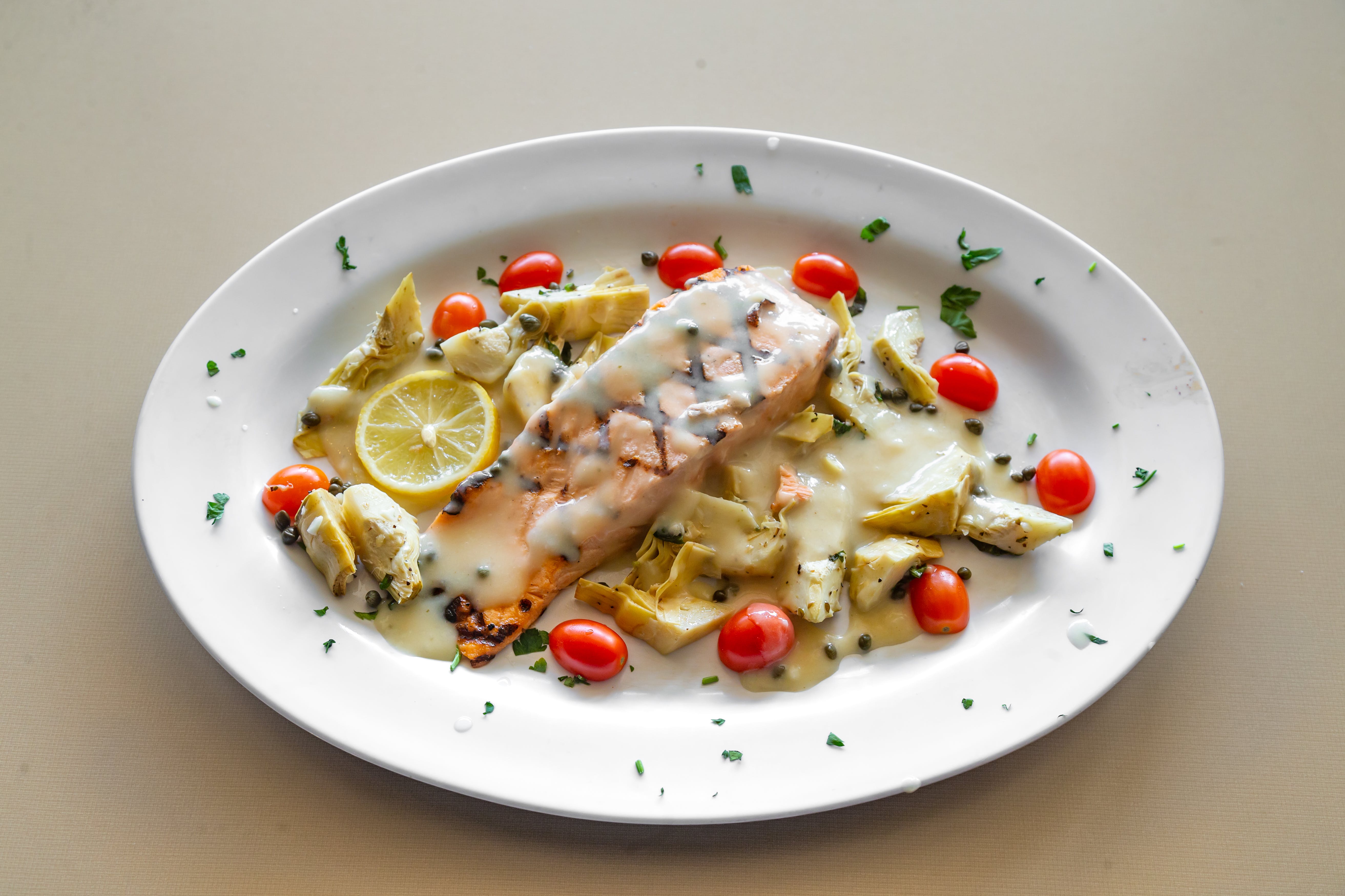 Order Salmon Provinciale - Pesce food online from Capellini Trattoria Pizzeria store, Selden on bringmethat.com