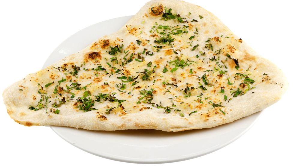 Order Garlic Naan food online from Fire Biryani store, Plano on bringmethat.com