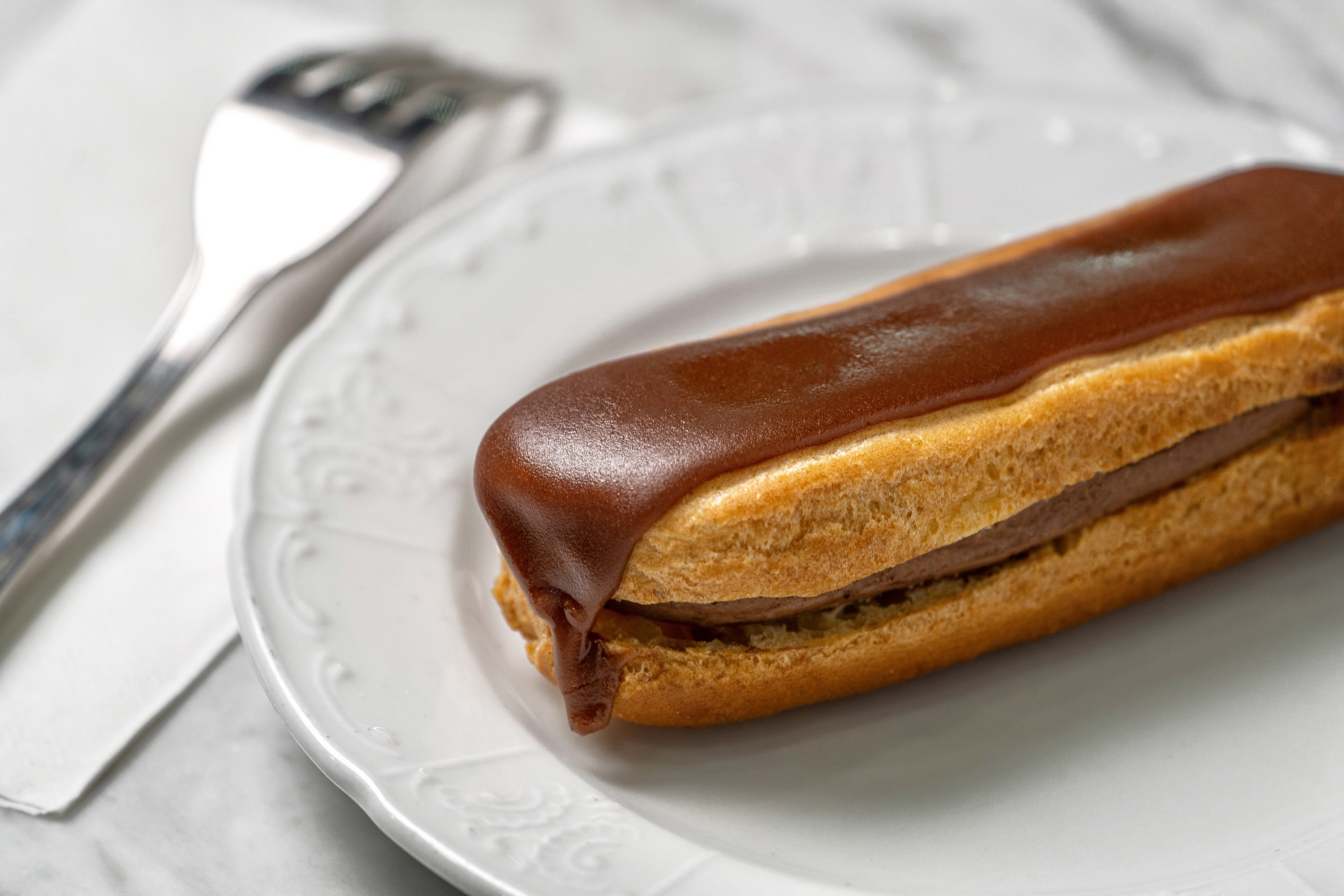 Order Chocolate Eclair food online from Le Paris Brest Cafe store, Las Vegas on bringmethat.com