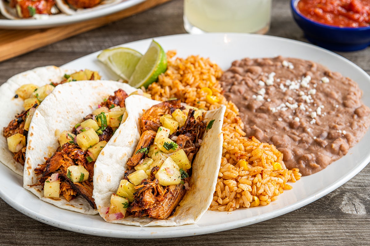 Order Tacos Al Pastor food online from On The Border store, Grandville on bringmethat.com