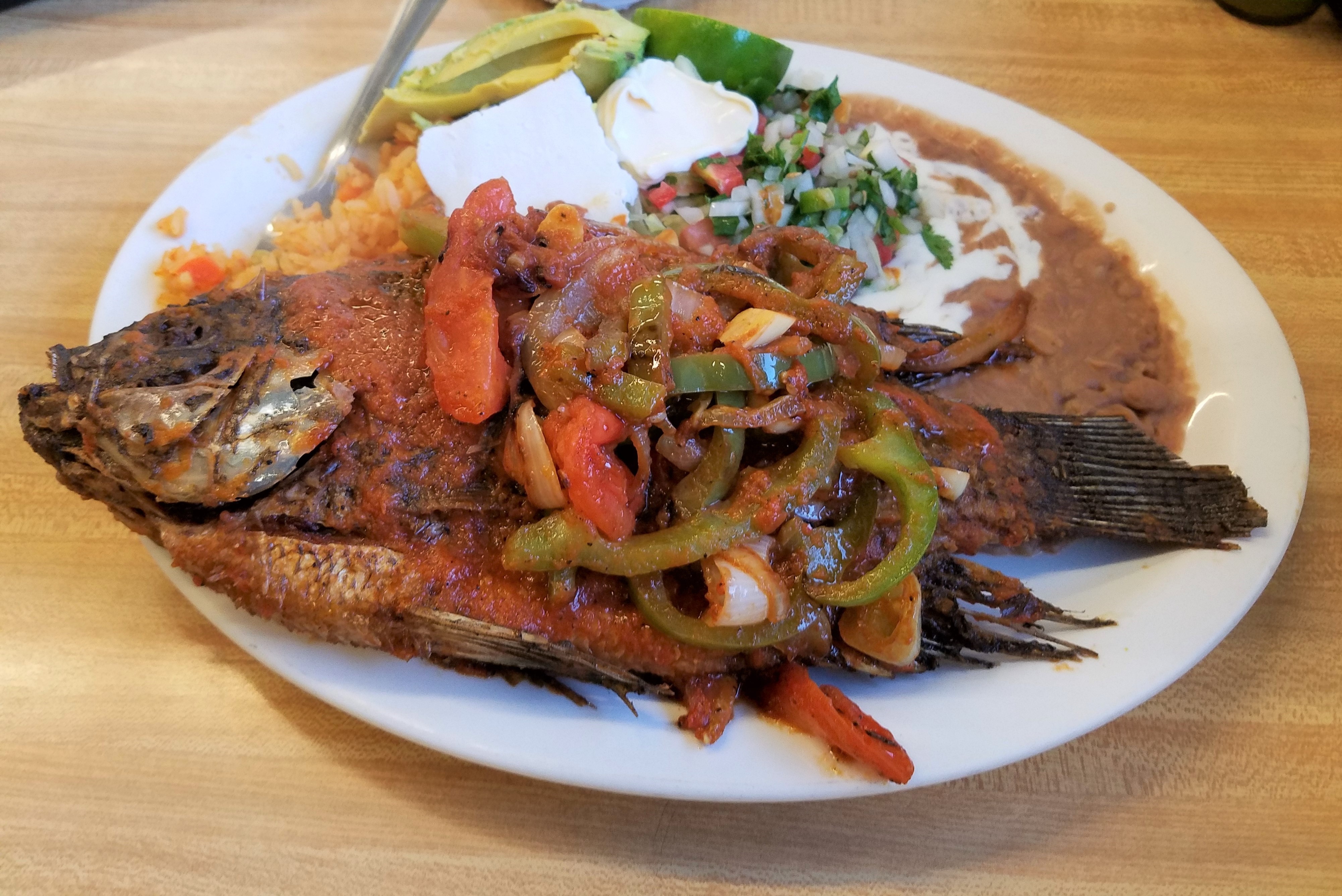 Order Mojarra with Rice, Beans & Salad food online from Las Fuentes store, Knoxville on bringmethat.com
