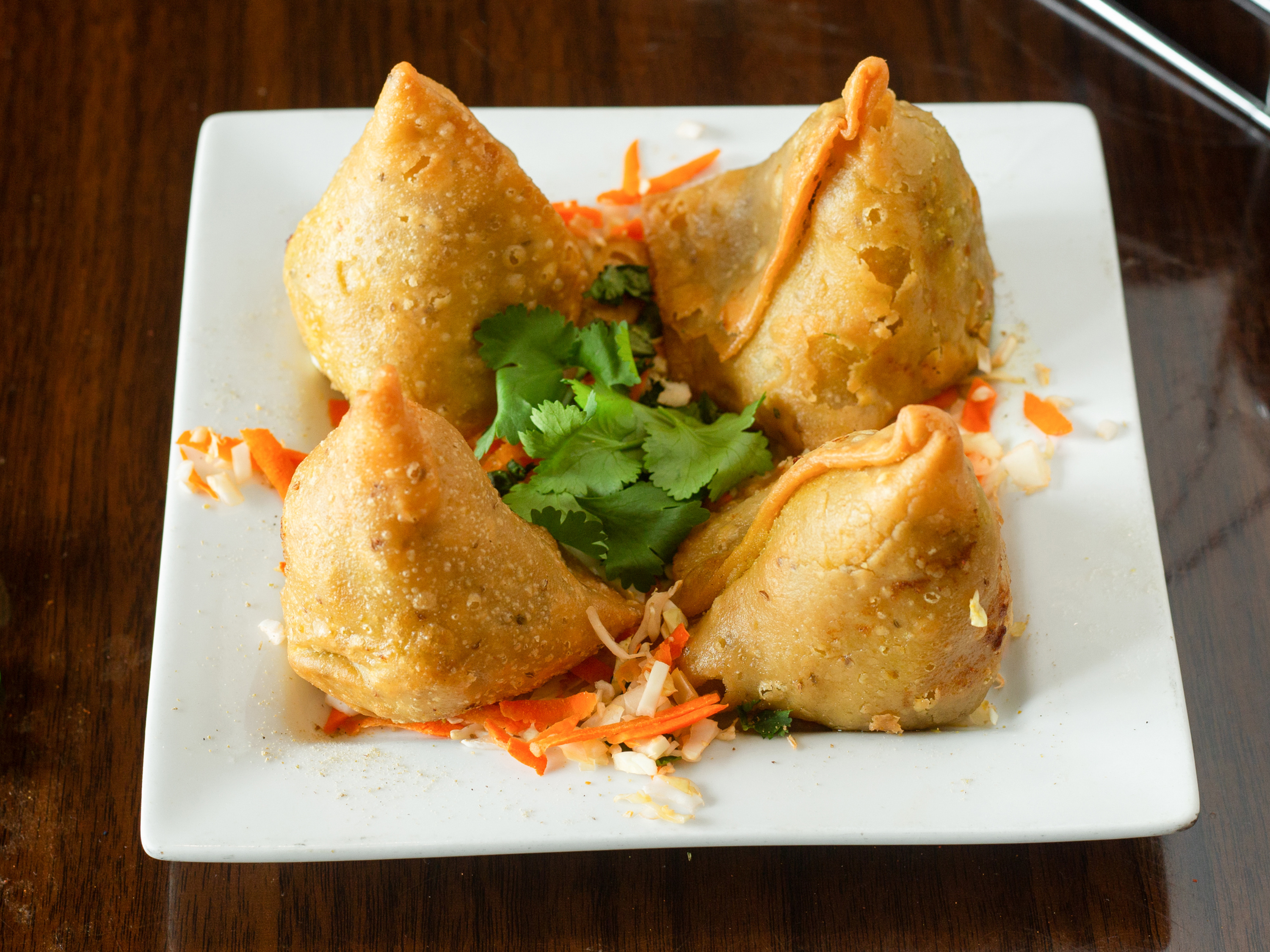 Order Vegetable Samosa (2 pieces) food online from Nirvana Indian Cuisine store, Myrtle Beach on bringmethat.com