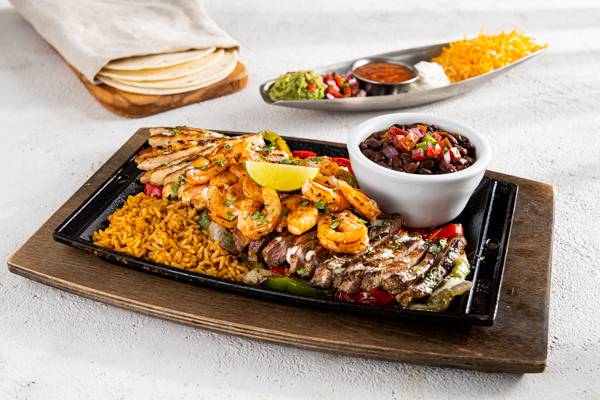 Order Mix & Match Fajita Trio food online from Chili's Grill & Bar store, Forest City on bringmethat.com