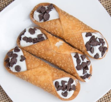 Order Mini Cannolis - 3 Pieces food online from Mario The Baker store, Miami on bringmethat.com