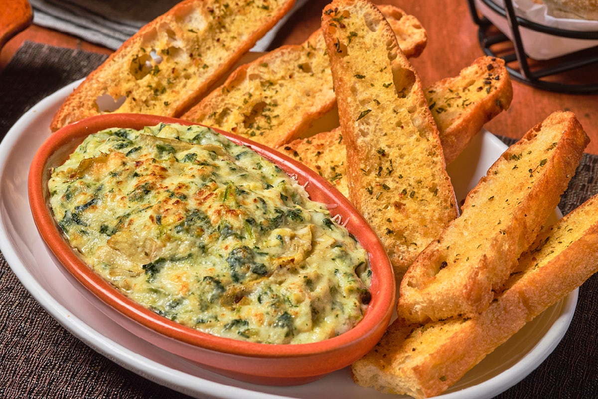 Order Spinach & Artichoke Dip food online from Bertucci's store, Plymouth Meeting on bringmethat.com