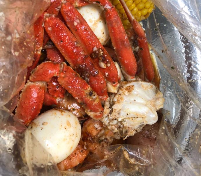 Order 1. Half Pound Snow Crab and 1/2 lb. No Head Shrimp Combo food online from Yummy Crab store, Omaha on bringmethat.com