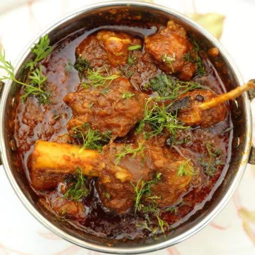 Order Andhra Goat Curry food online from Minerva Indian Cuisine store, Gaithersburg on bringmethat.com