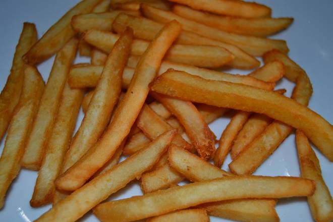 Order French Fries food online from Tommy's Original Pizza store, West Chester on bringmethat.com