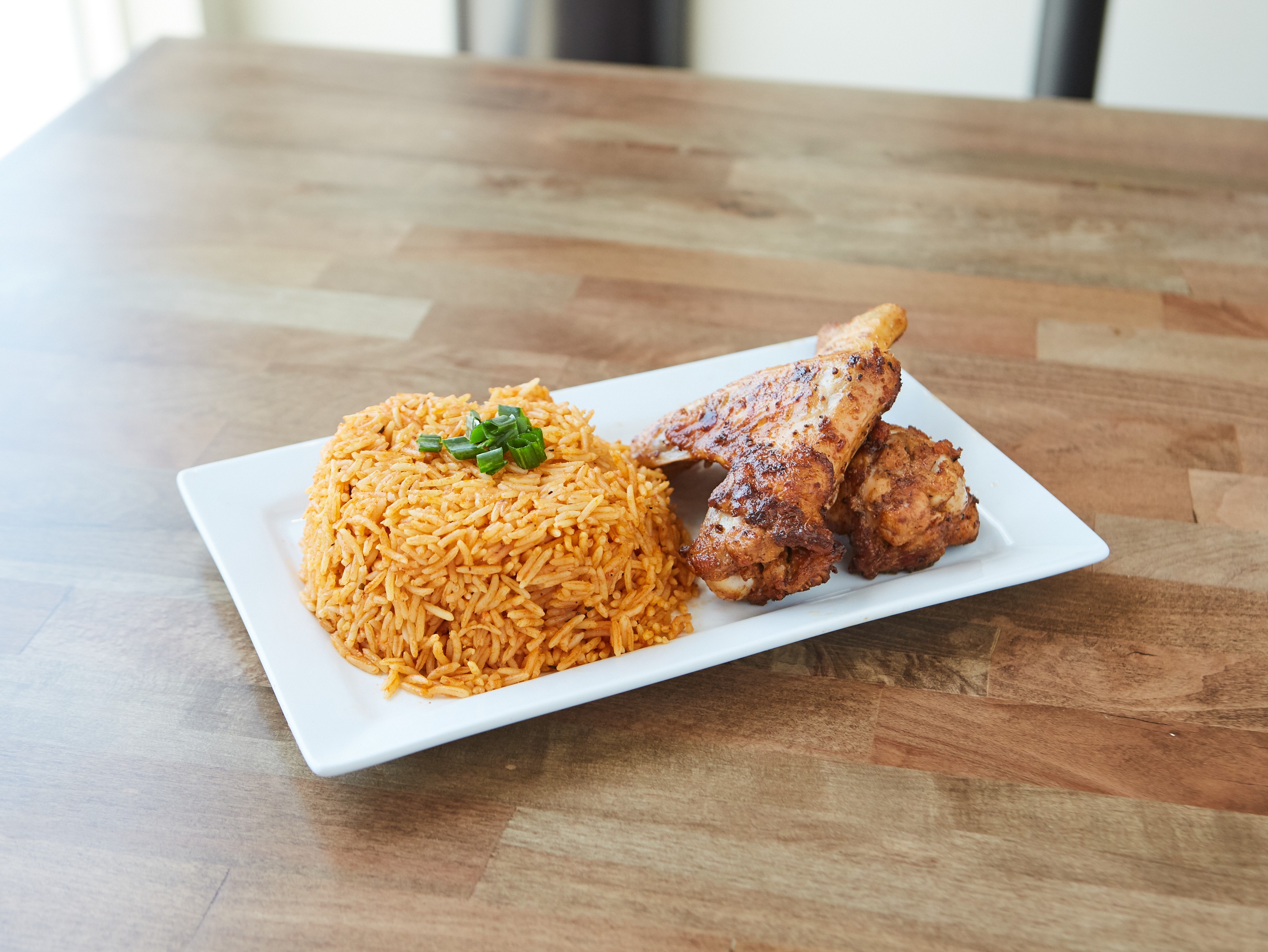 Order Jollof Rice and Chicken Suya Wings food online from Fusion Vibes Kitchen + Bar store, Richardson on bringmethat.com