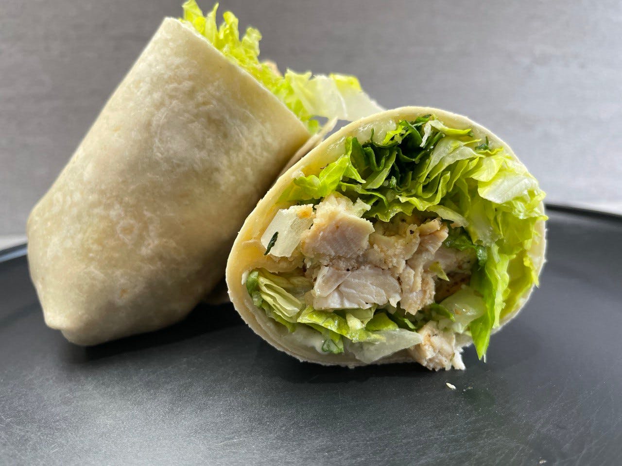 Order Chicken Caesar Wrap - Wrap food online from Troys Italian Kitchen store, Arlington on bringmethat.com