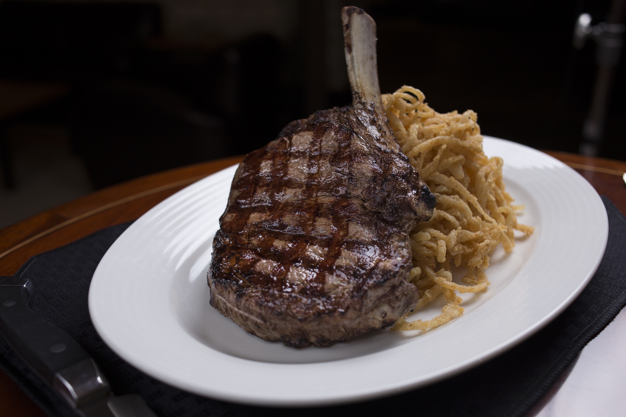 Order 24 oz. Prime "Cowboy Cut" Ribeye food online from Kirby Prime Steakhouse store, The Woodlands on bringmethat.com