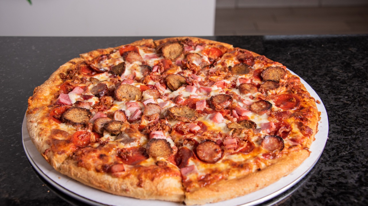 Order Meat Lovers Pizza food online from Yovanis Pizzeria store, Cumberland on bringmethat.com