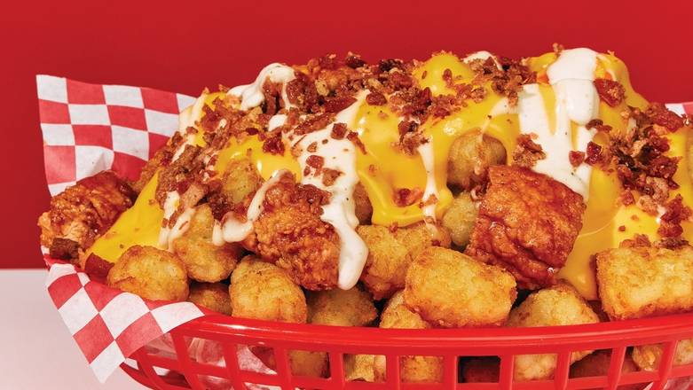Order Cheesy Chicken Loaded Nachos: Tots food online from Wings Over Rutgers store, New Brunswick on bringmethat.com