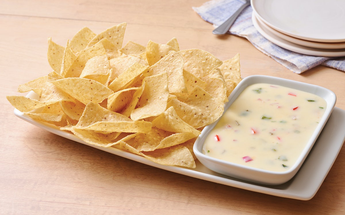 Order White Queso Dip & Chips food online from Applebee's - JT Butler store, Jacksonville on bringmethat.com
