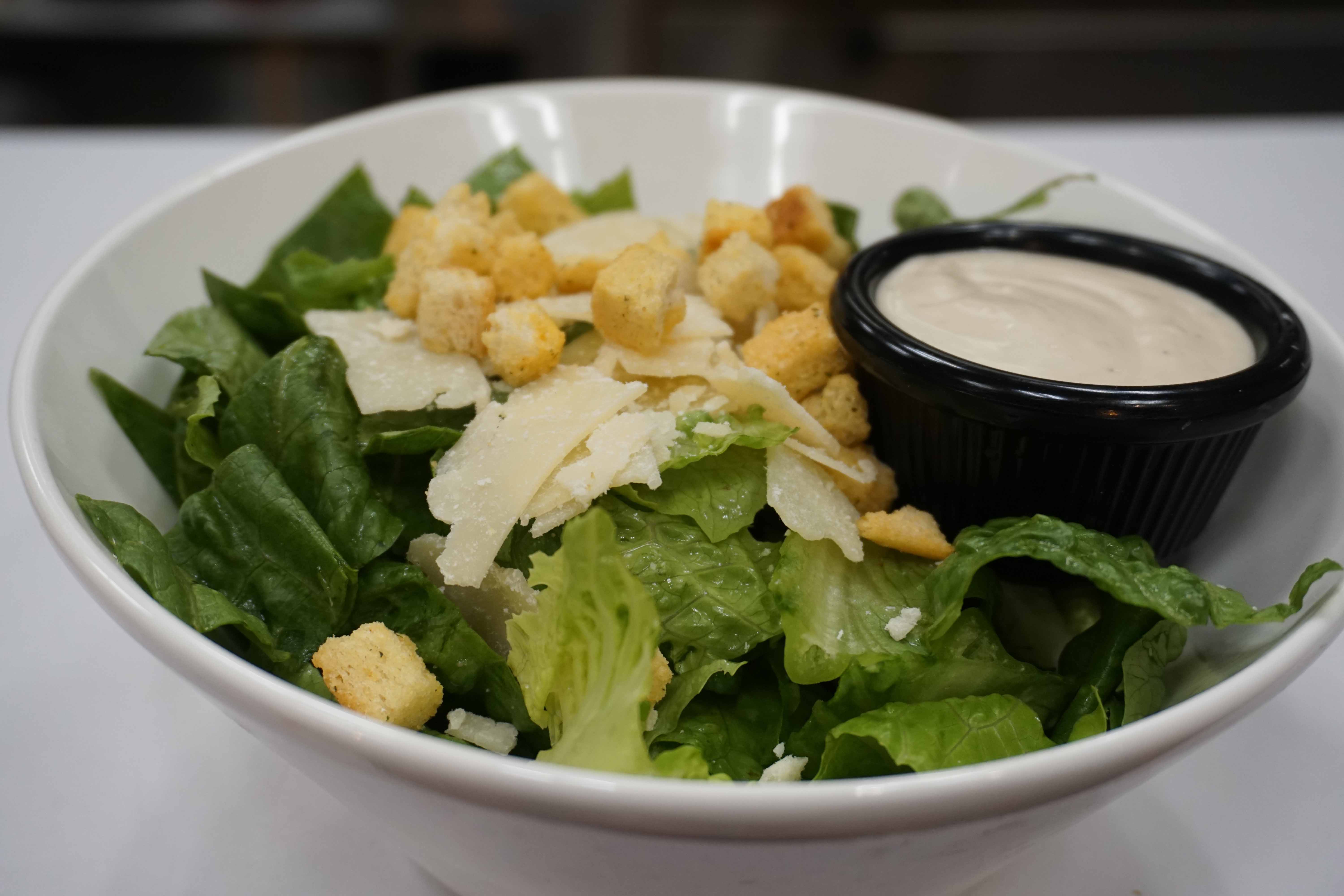 Order Caesar Salad food online from zpizza Tap Room store, La Jolla on bringmethat.com