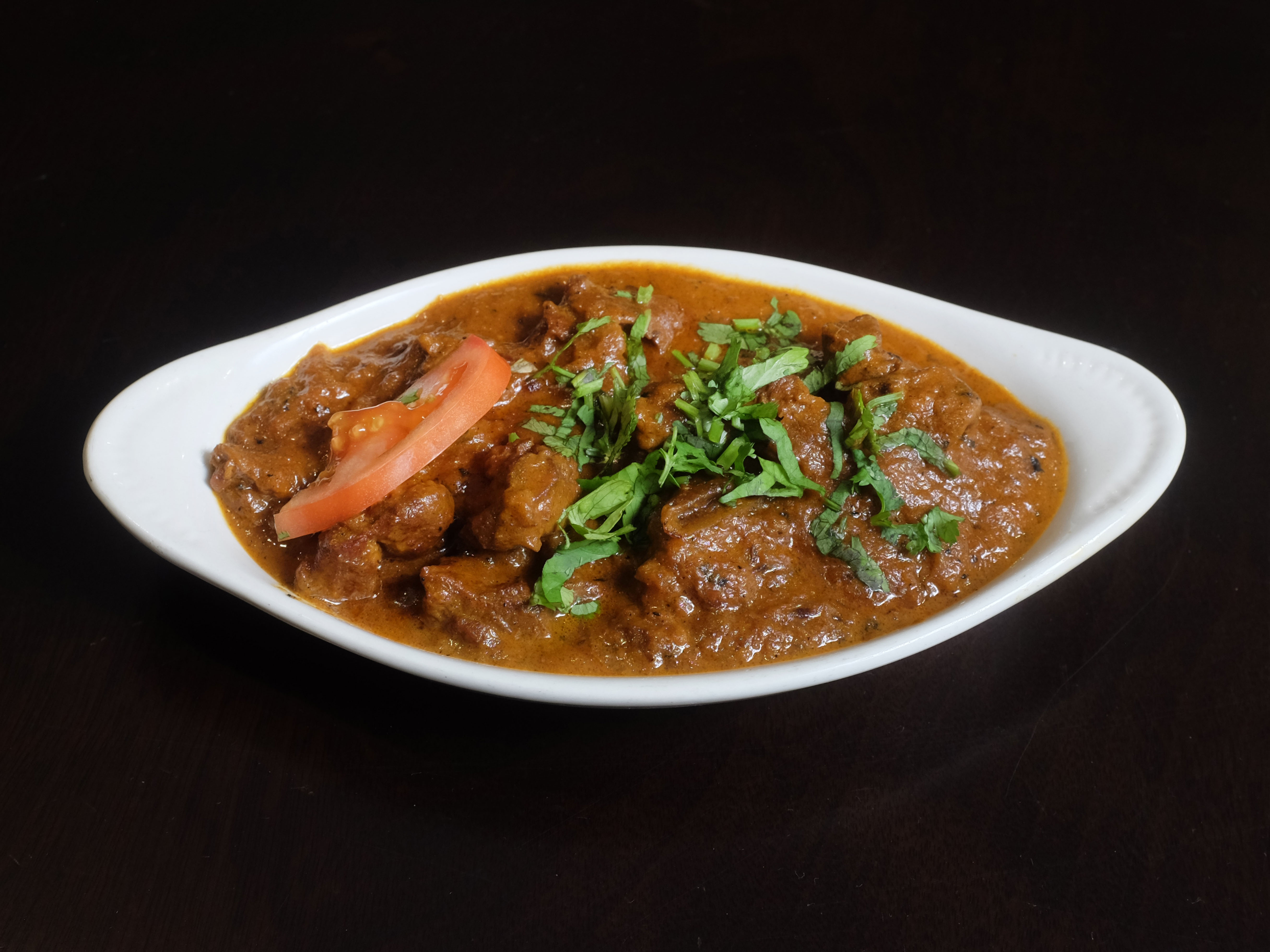 Order 18.) Lamb Curry food online from New Paradise store, Wichita on bringmethat.com